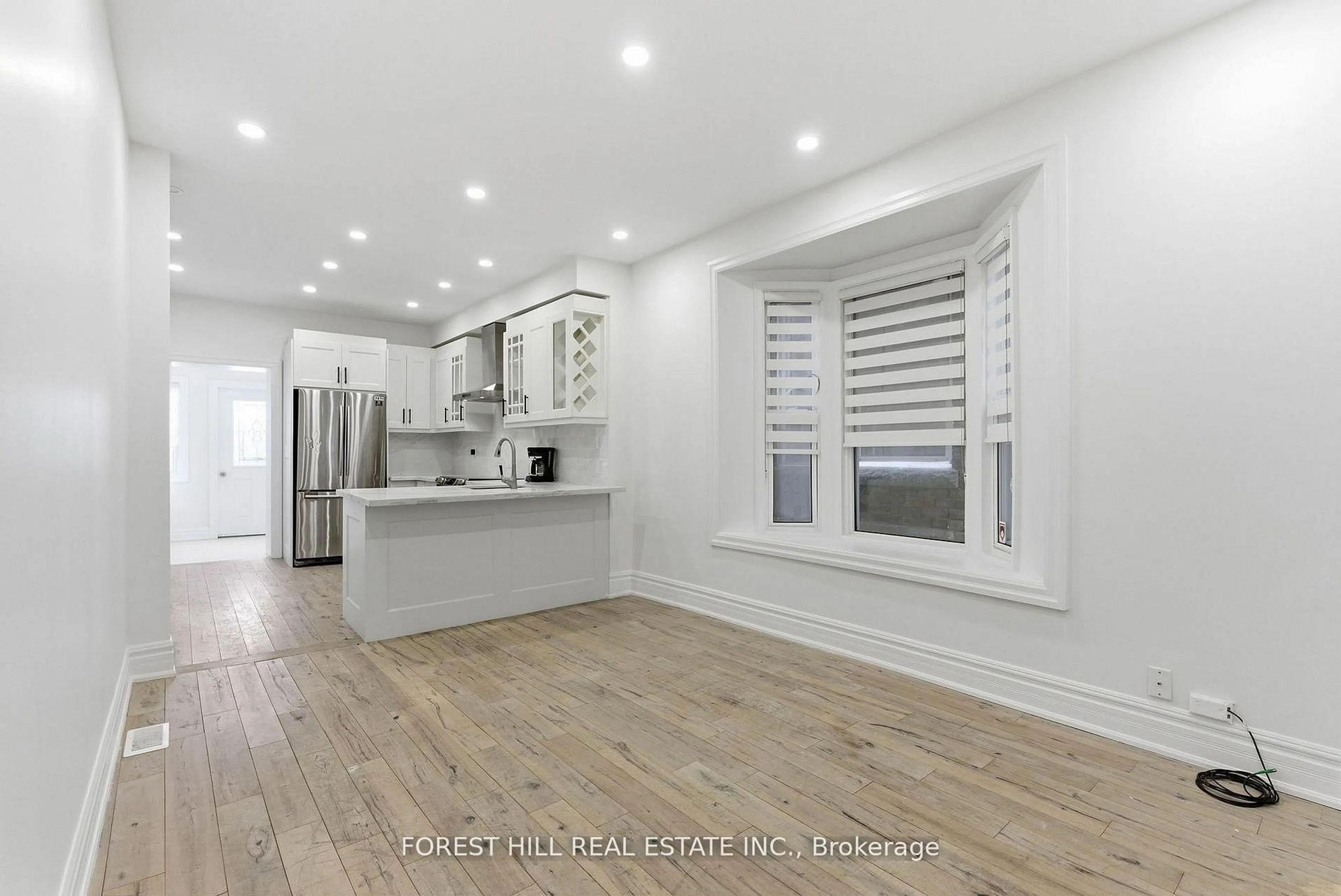 Open concept kitchen, wood/laminate floor for 1297 Davenport Rd, Toronto Ontario M6H 2H3