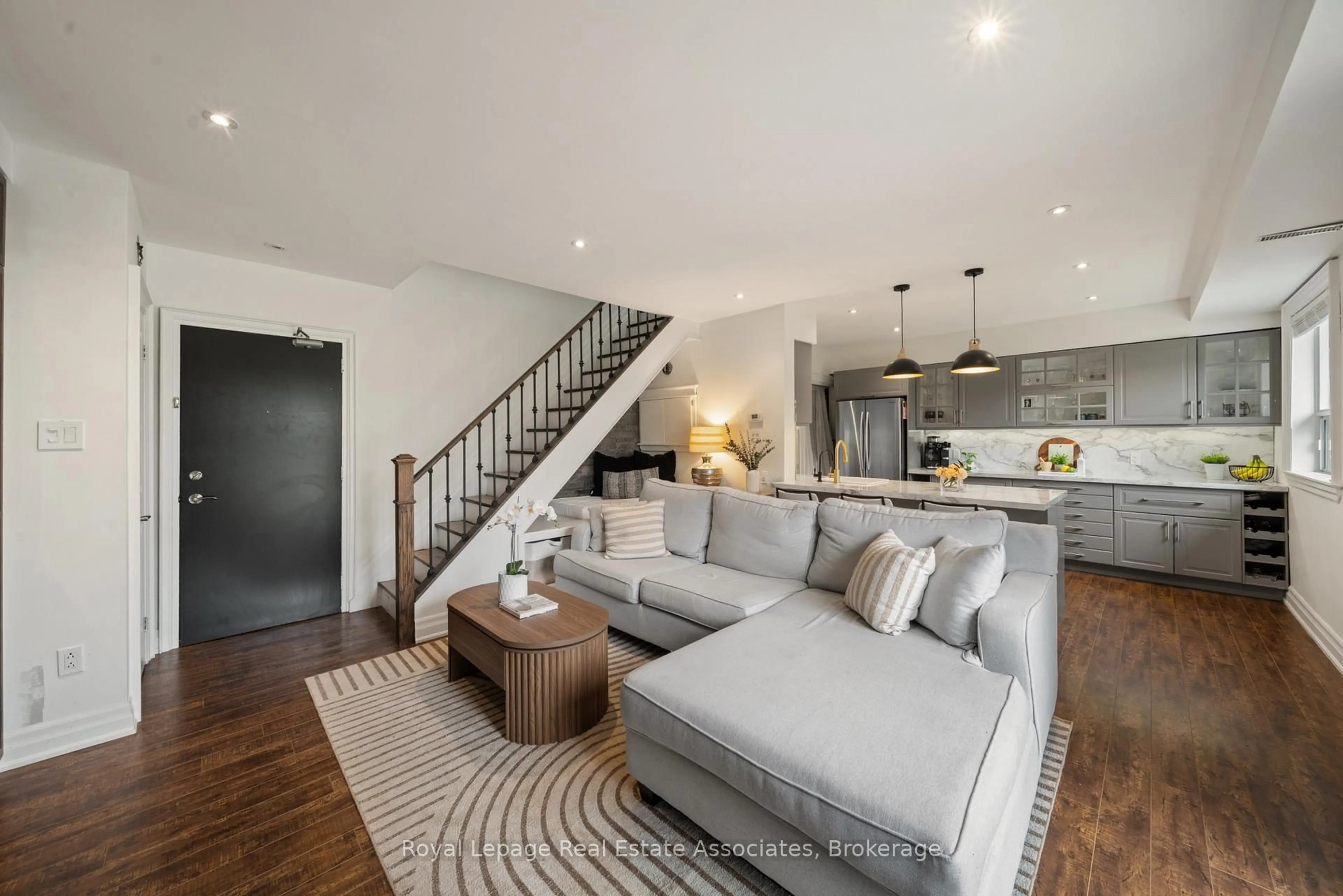 Living room with furniture, cement floor for 469 Claridge Rd #4, Burlington Ontario L7N 2S1