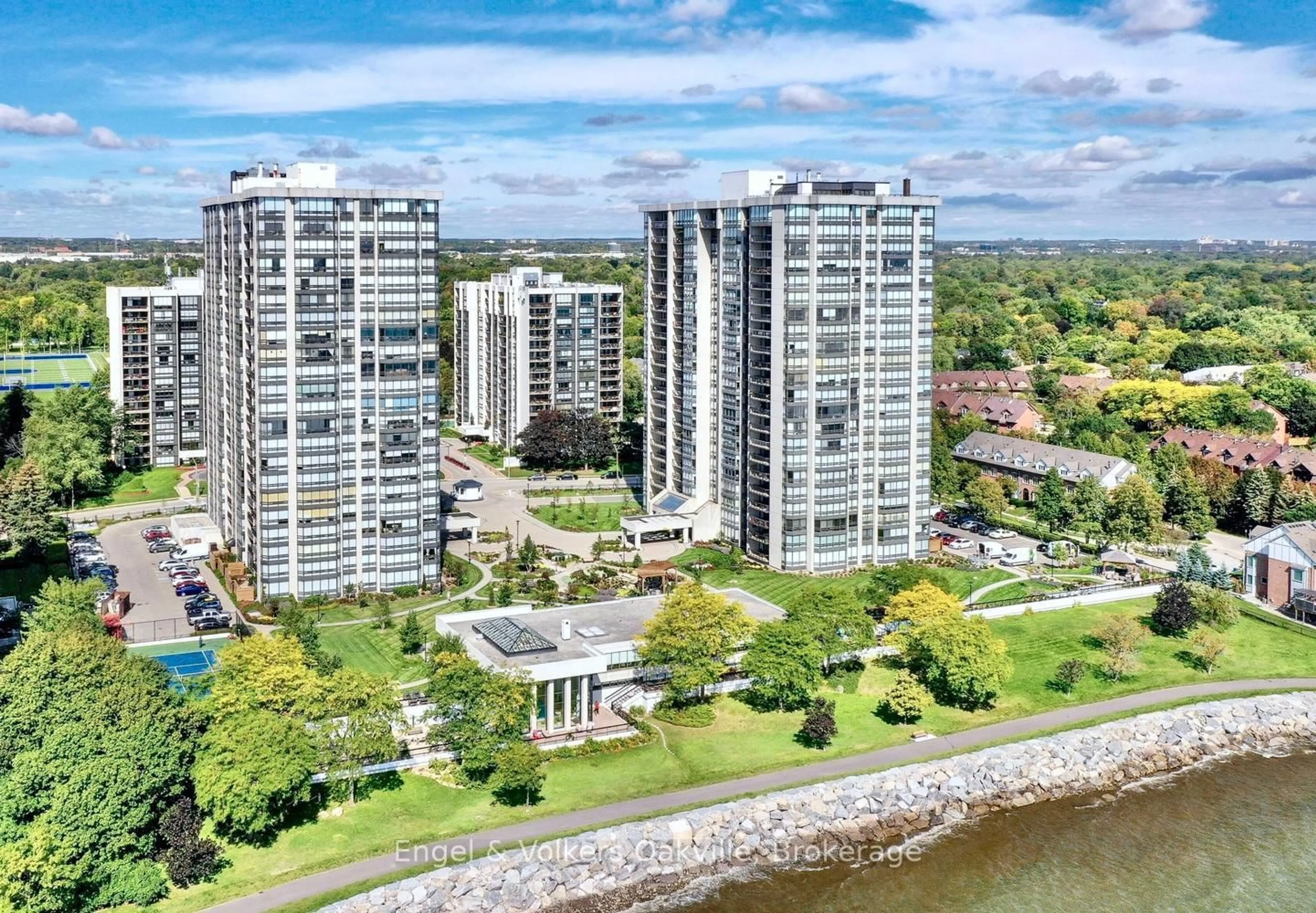 A pic from outside/outdoor area/front of a property/back of a property/a pic from drone, water/lake/river/ocean view for 2180 Marine Dr #205, Oakville Ontario L6L 5V2