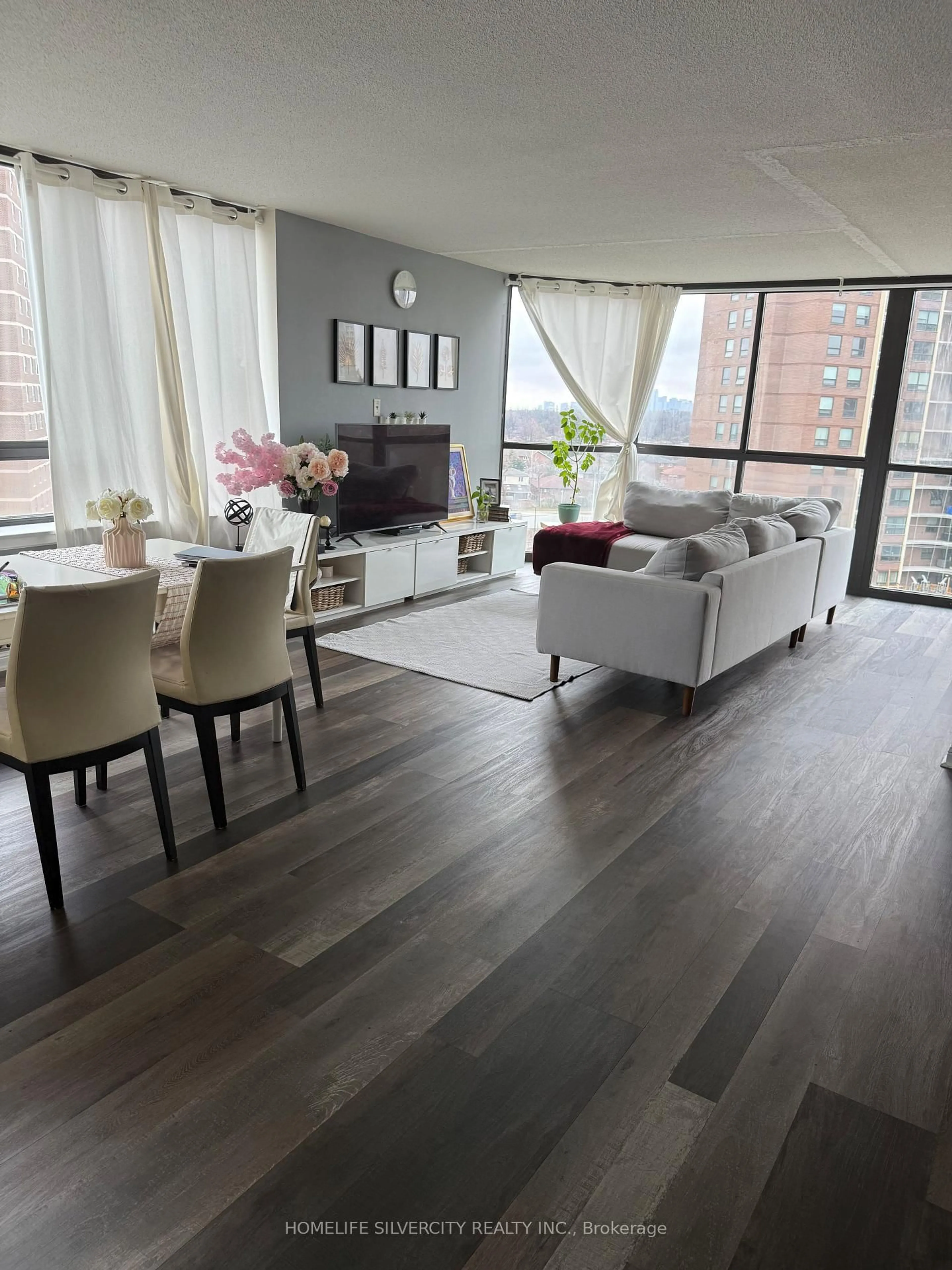 Living room with furniture, wood/laminate floor for 40 Richview Rd #707, Toronto Ontario M9A 5C1