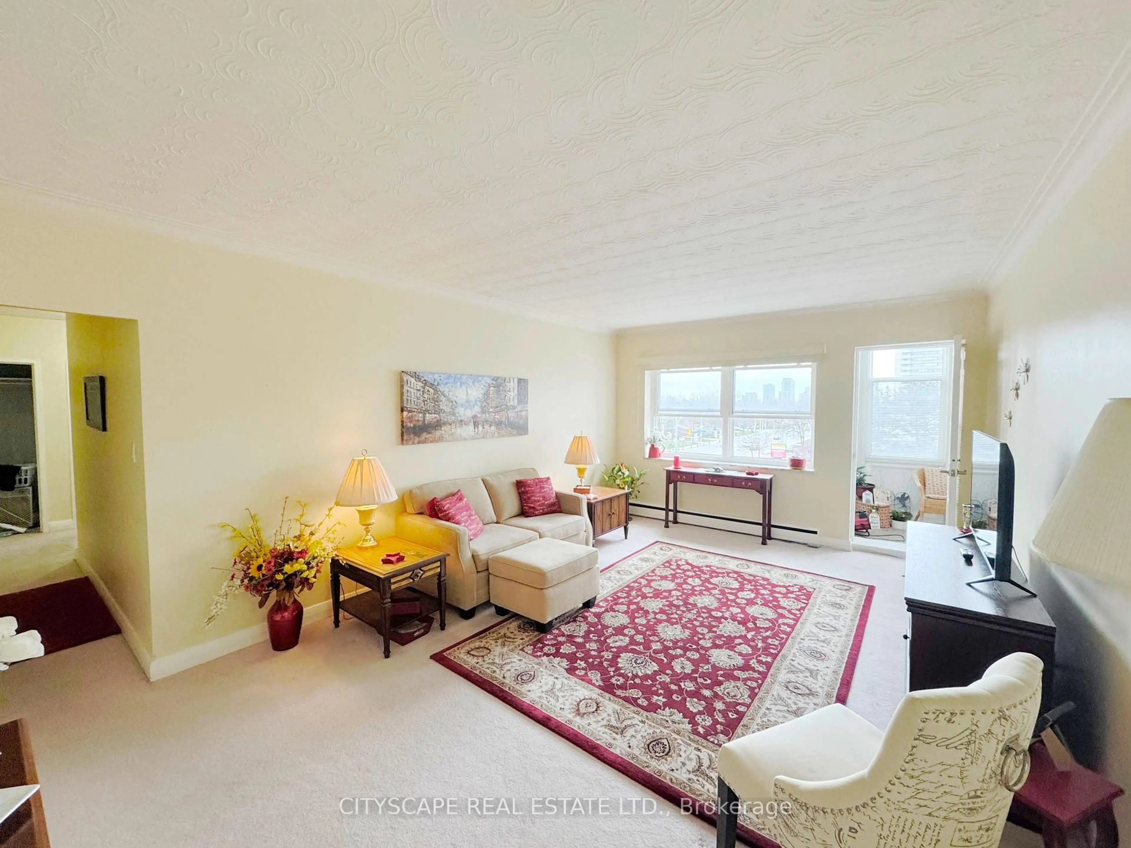 Living room with furniture, carpet floor for 824 Brant St #25, Burlington Ontario L7R 2J5