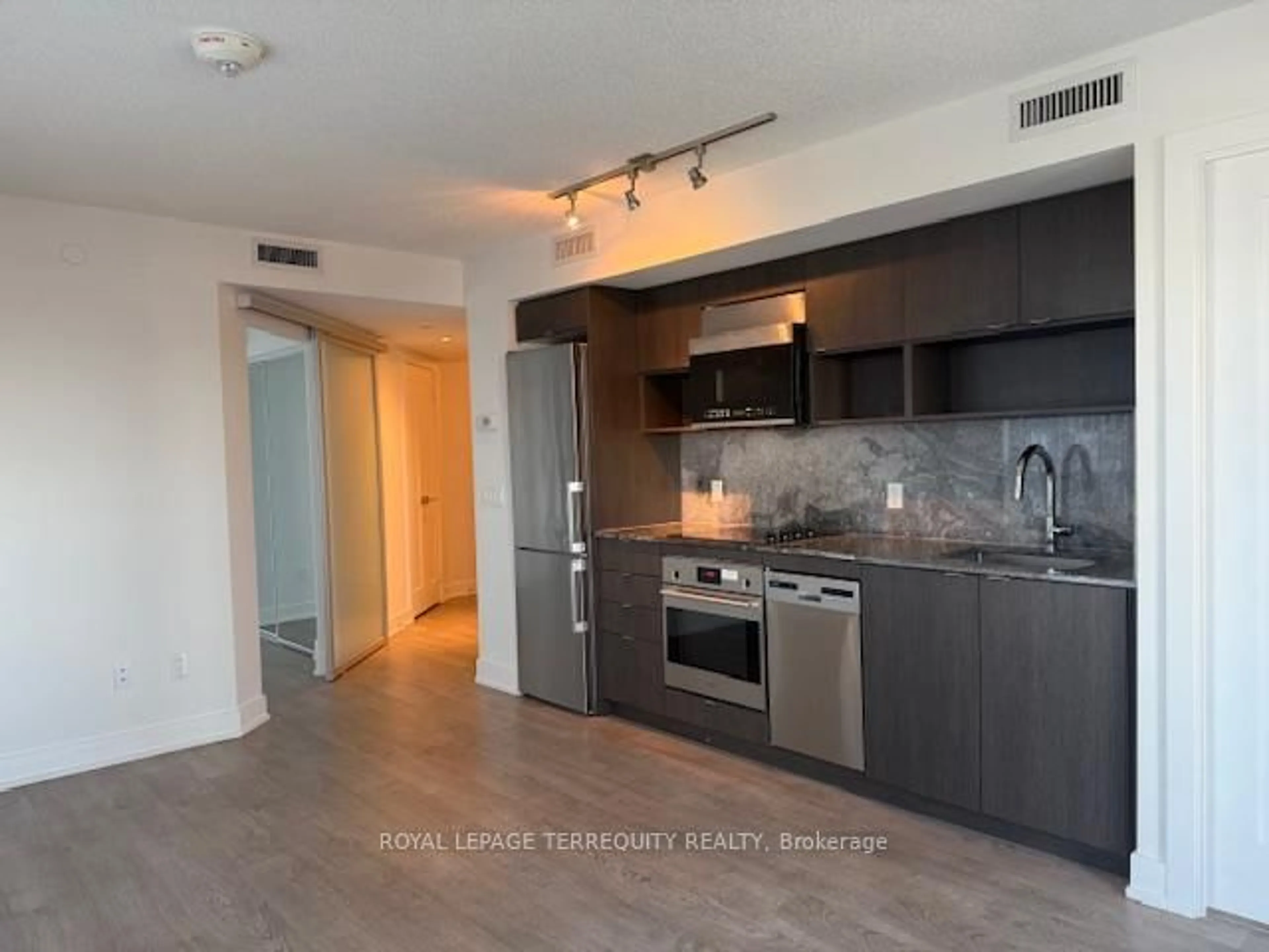 Open concept kitchen, wood/laminate floor for 7 Mabelle Ave #604, Toronto Ontario M9A 0C9