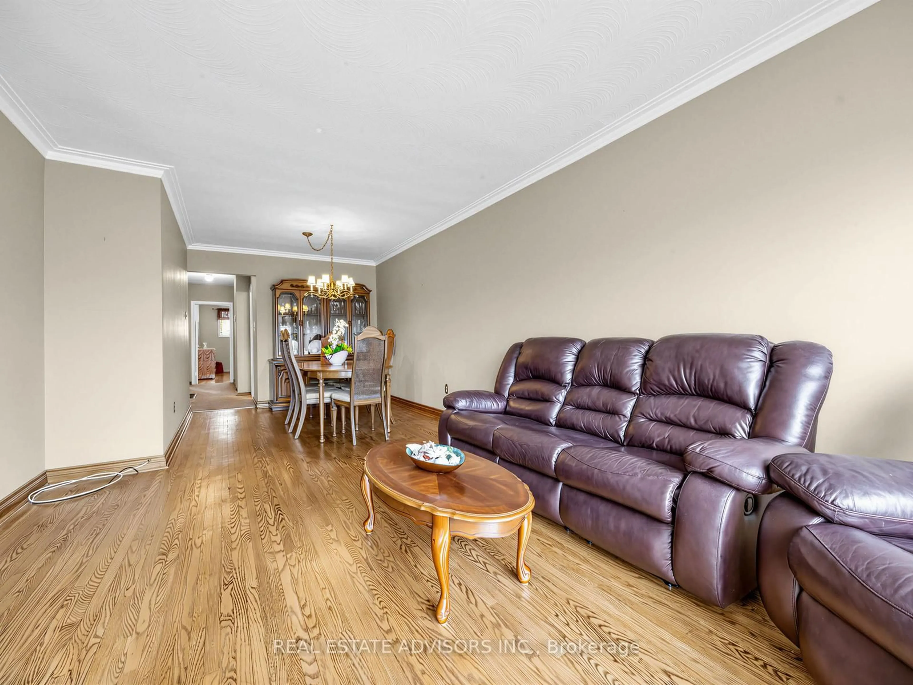 Living room with furniture, wood/laminate floor for 175 Lindylou Rd, Toronto Ontario M9M 2B8