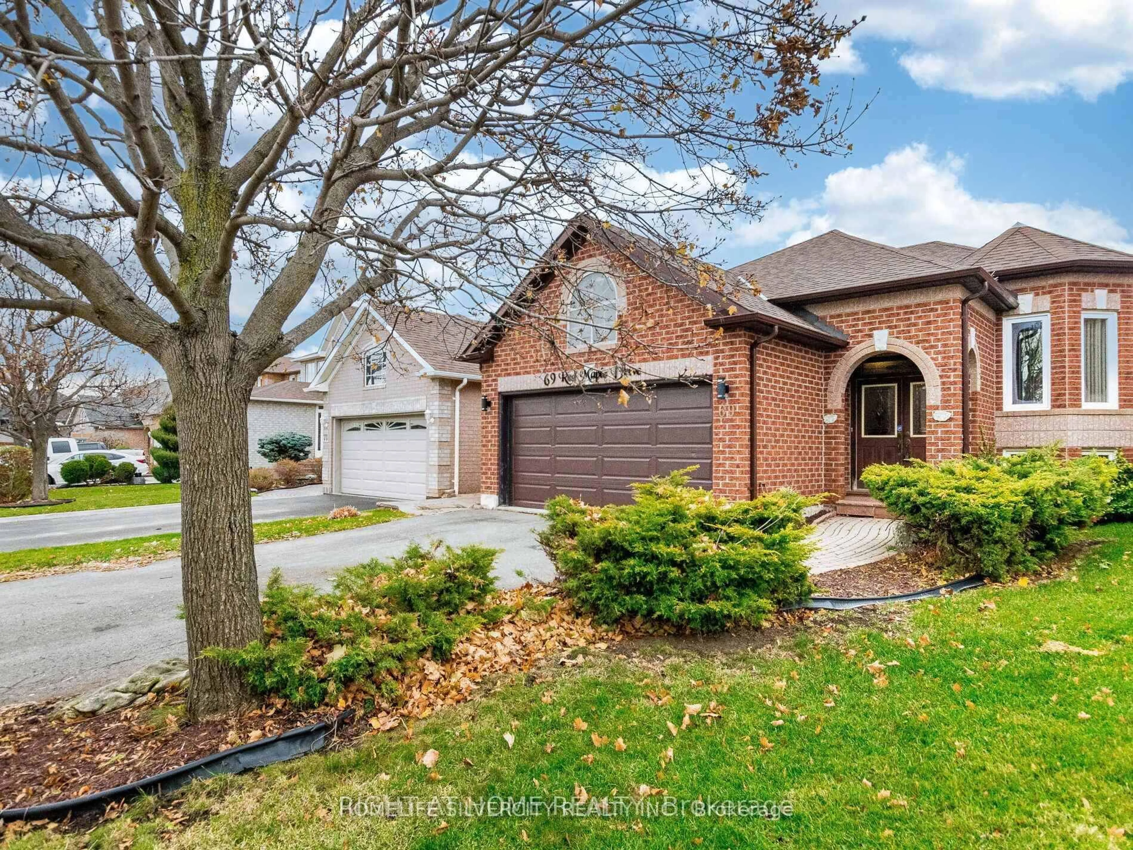 Home with brick exterior material, street for 69 Red Maple Dr, Brampton Ontario L6X 4M1