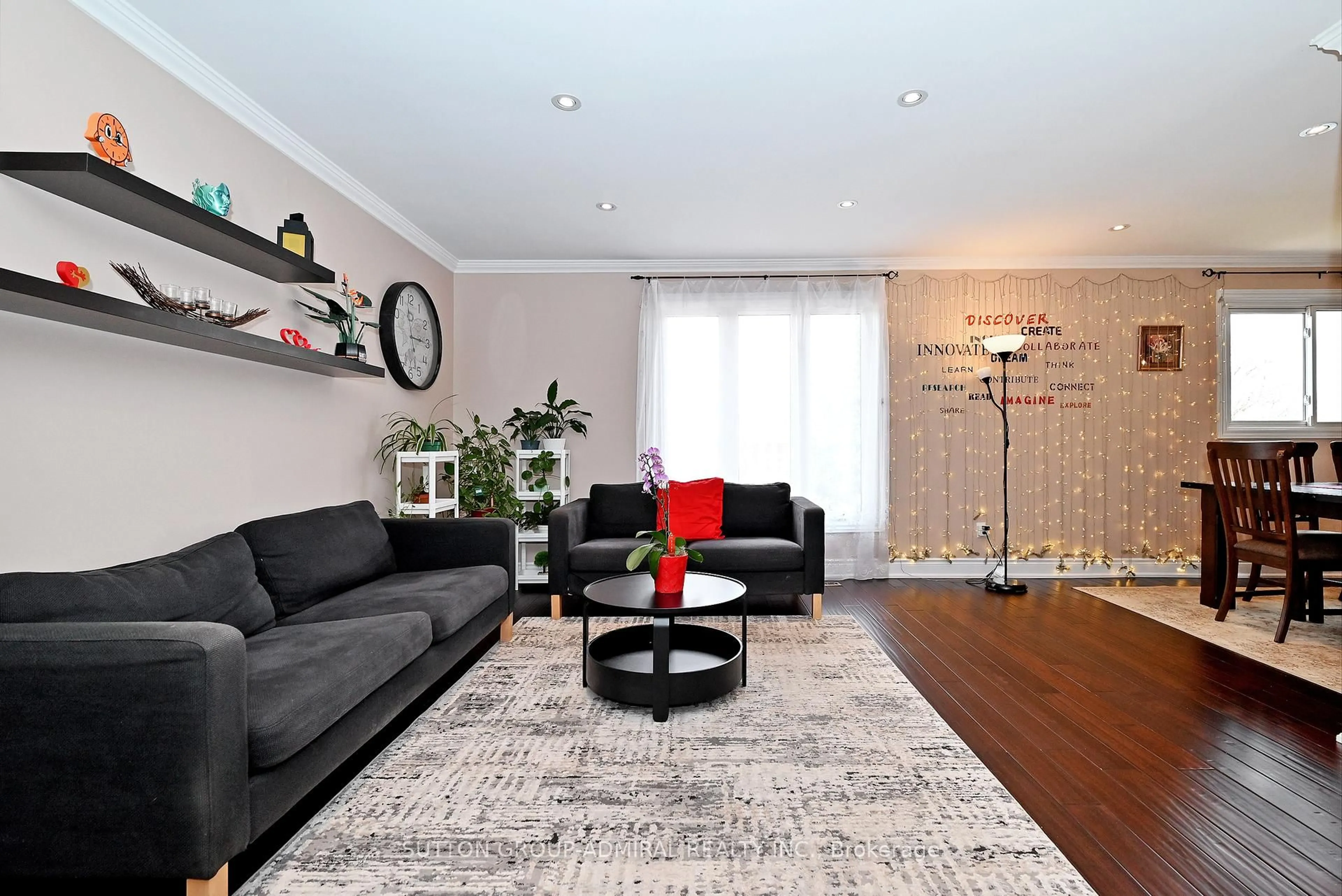 Living room with furniture, wood/laminate floor for 21 Bigham Cres, Toronto Ontario M9C 5C5