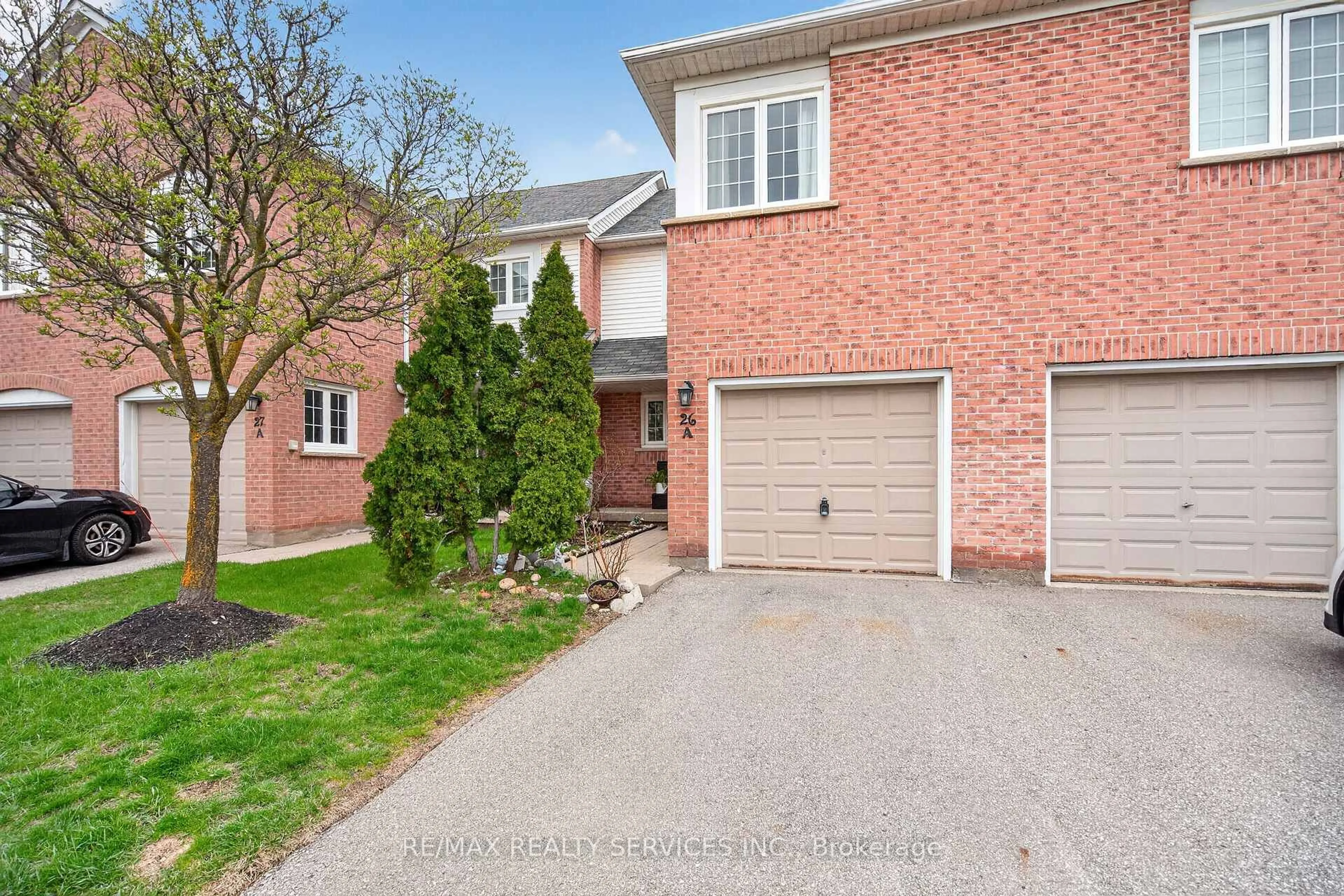 Home with brick exterior material, street for 5205 Glen Erin Dr #26A, Mississauga Ontario L5M 5N6