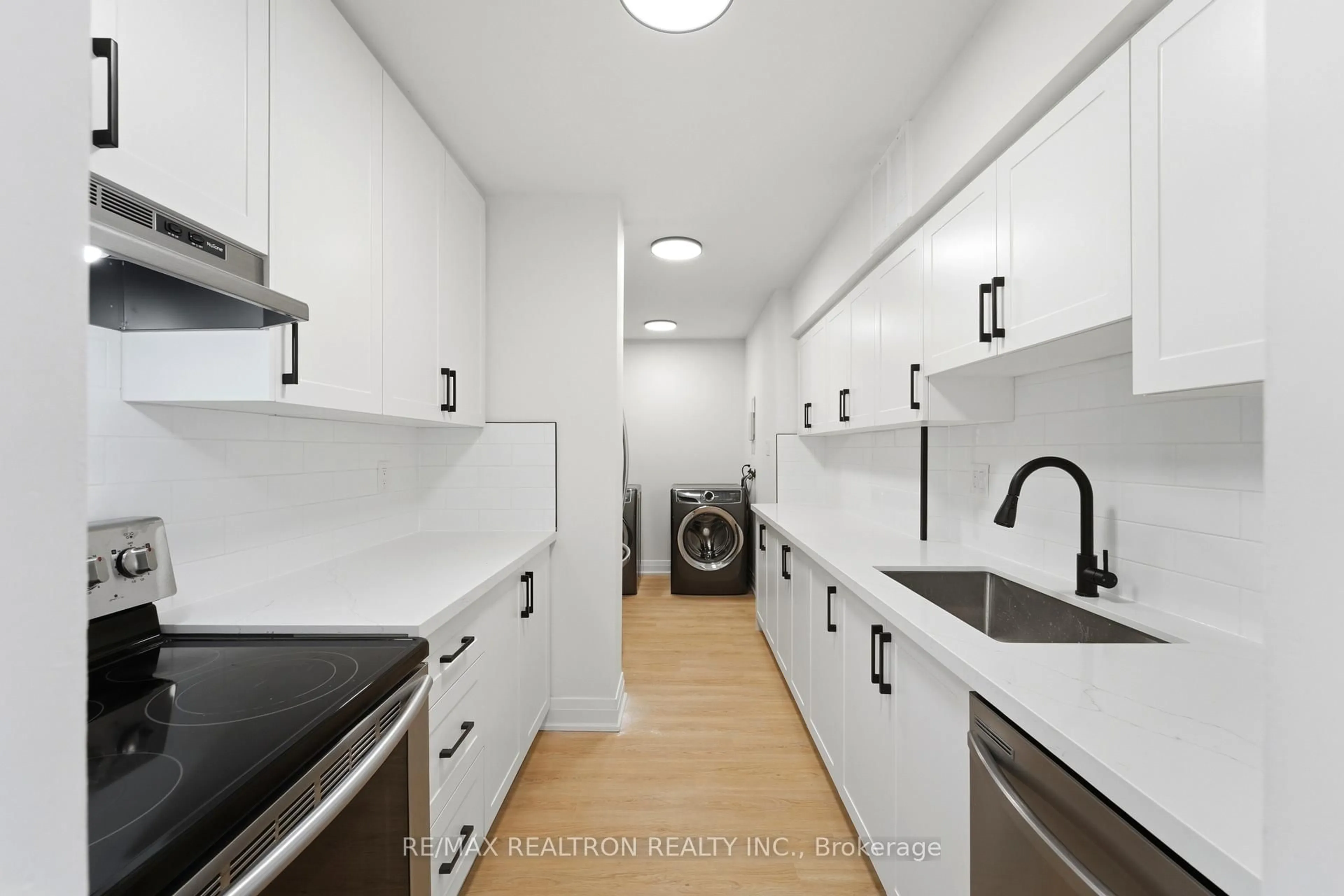 Kitchen with laundary machines, ceramic/tile floor for 370 Dixon Rd #1410, Toronto Ontario M9R 1T2