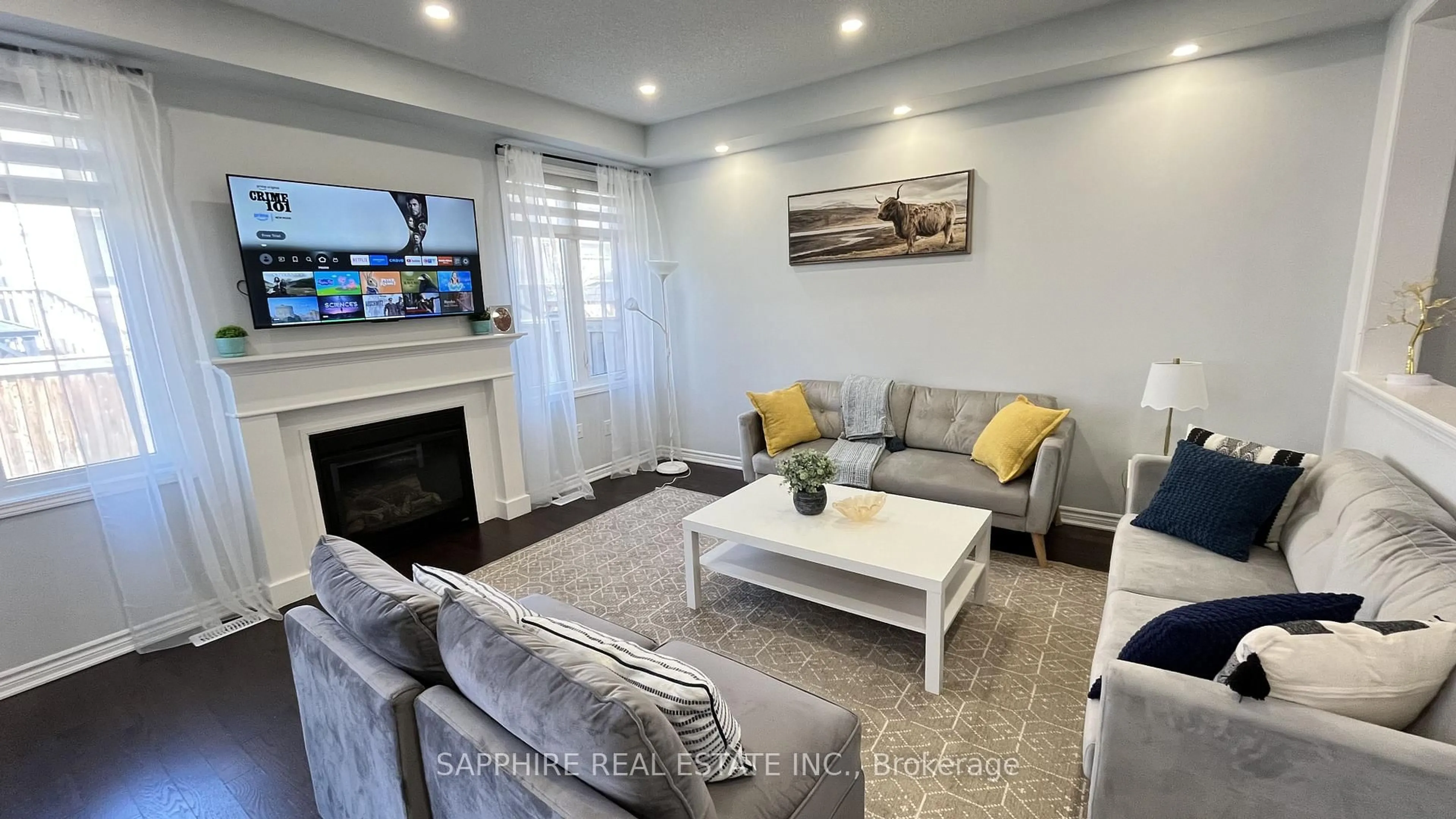 Living room with furniture, wood/laminate floor for 325 Trudeau Dr, Milton Ontario L9T 8Y7