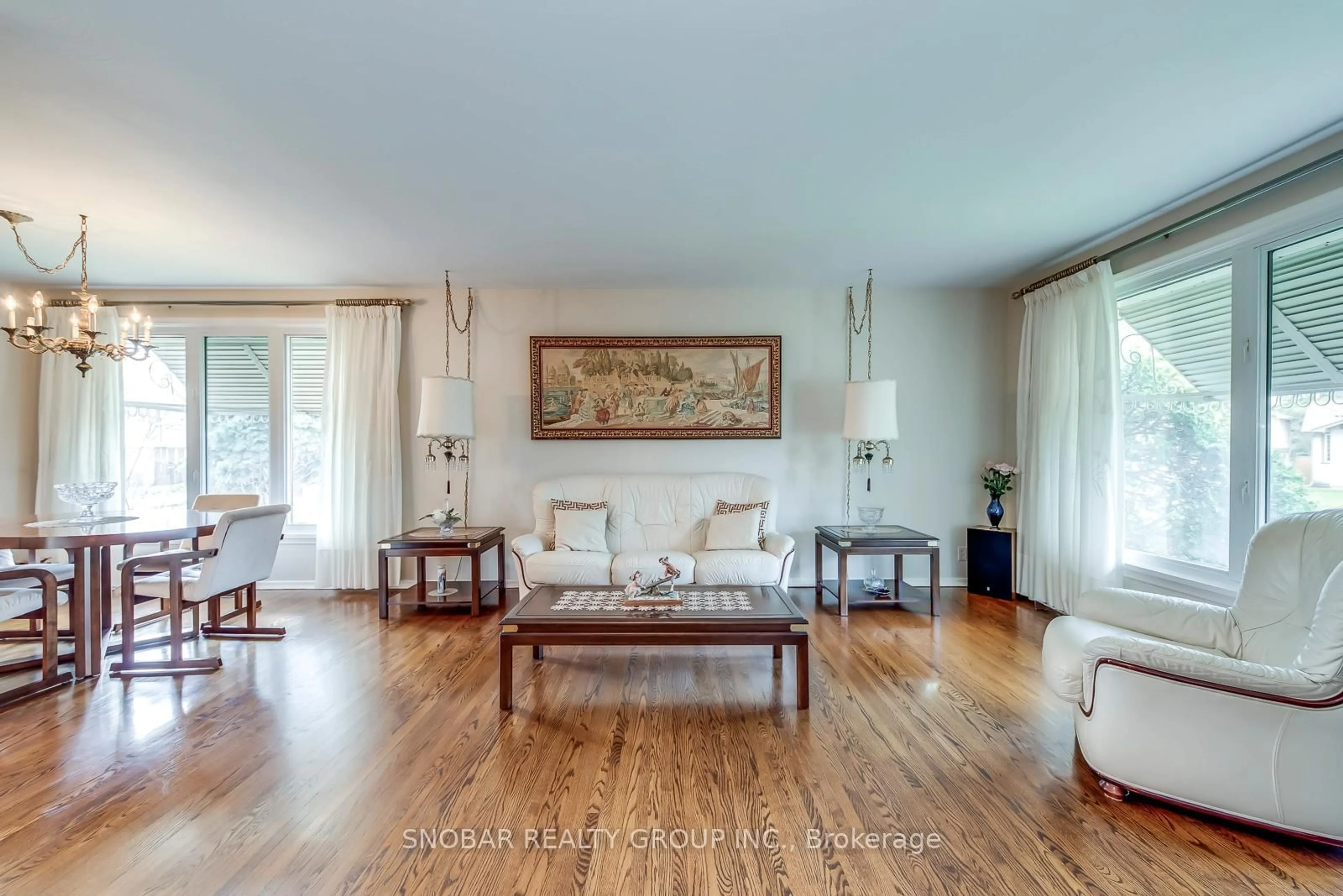 Living room with furniture, wood/laminate floor for 14 Tyler Pl, Toronto Ontario M9R 1L9