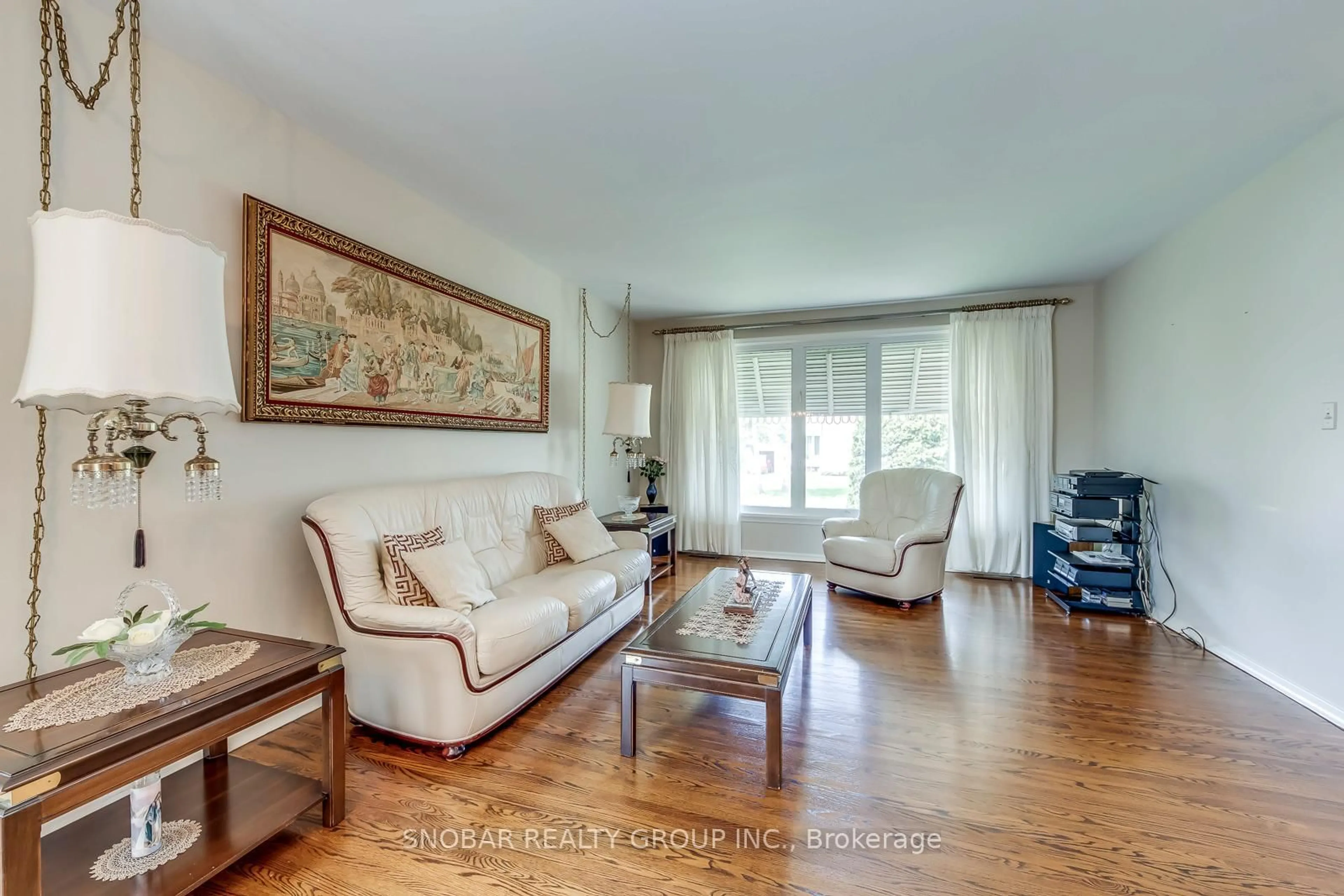 Living room with furniture, wood/laminate floor for 14 Tyler Pl, Toronto Ontario M9R 1L9