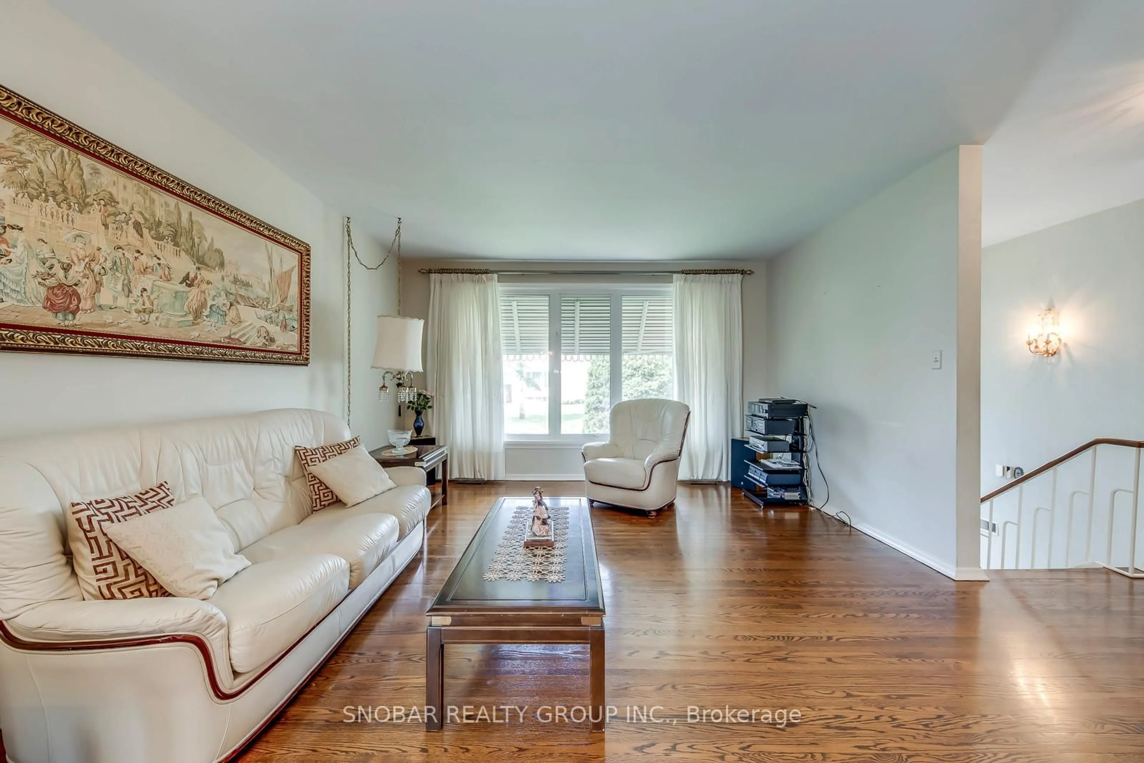 Living room with furniture, wood/laminate floor for 14 Tyler Pl, Toronto Ontario M9R 1L9