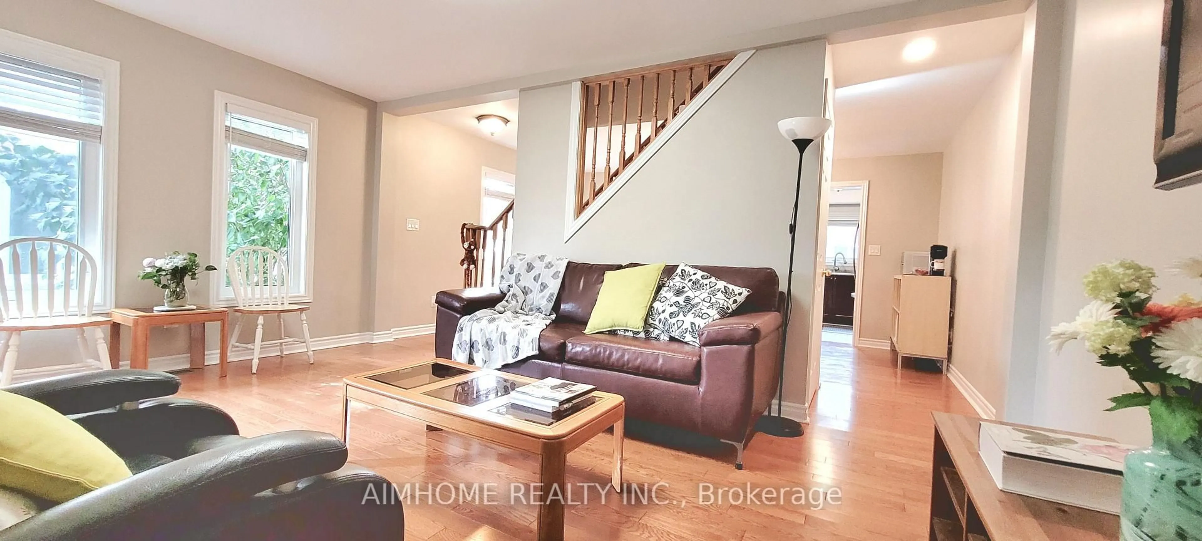 Living room with furniture, wood/laminate floor for 42 Piane Ave, Brampton Ontario L6Y 4X9