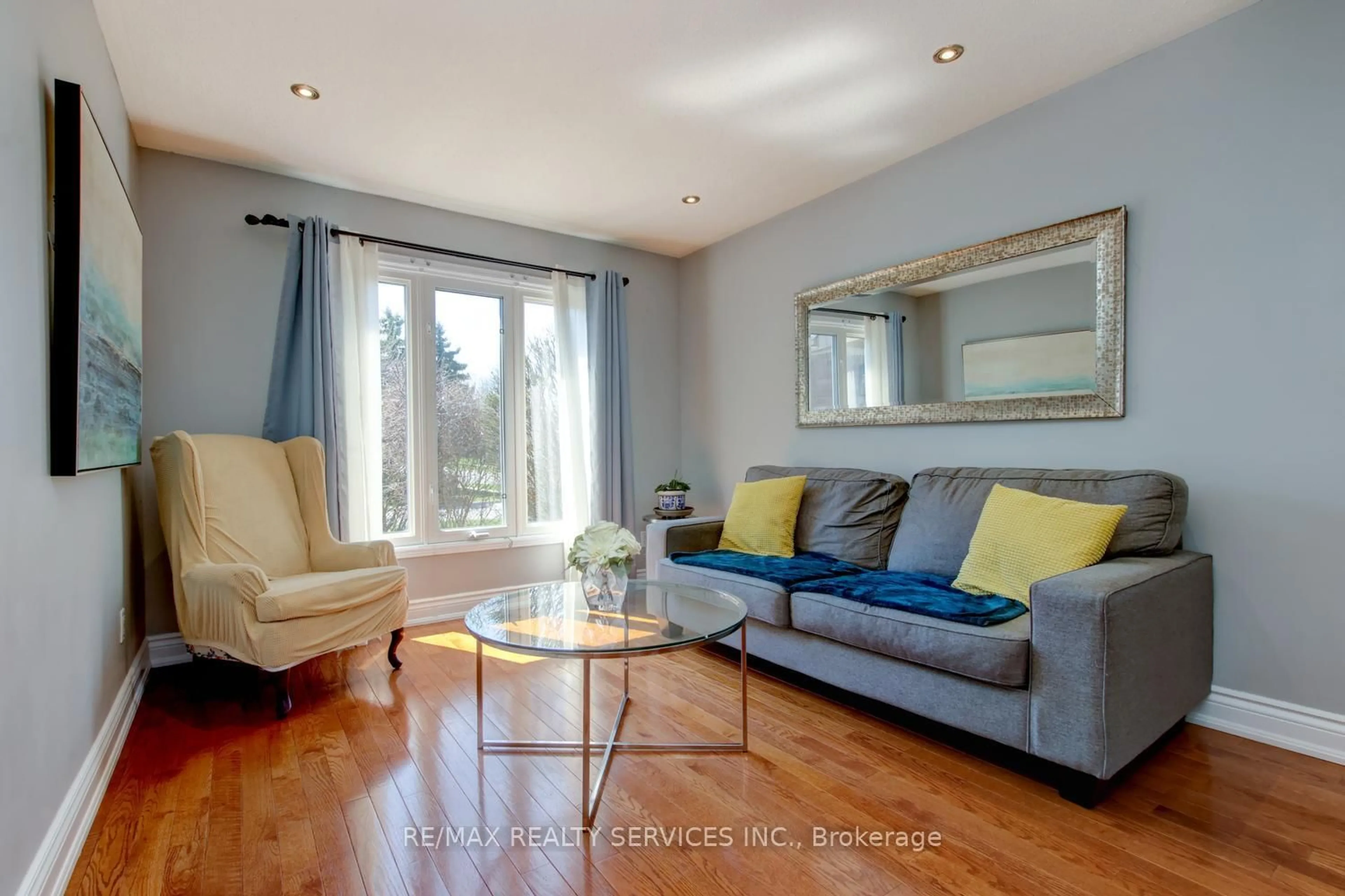 Living room with furniture, wood/laminate floor for 3 Nymark Pl, Brampton Ontario L6S 5T5