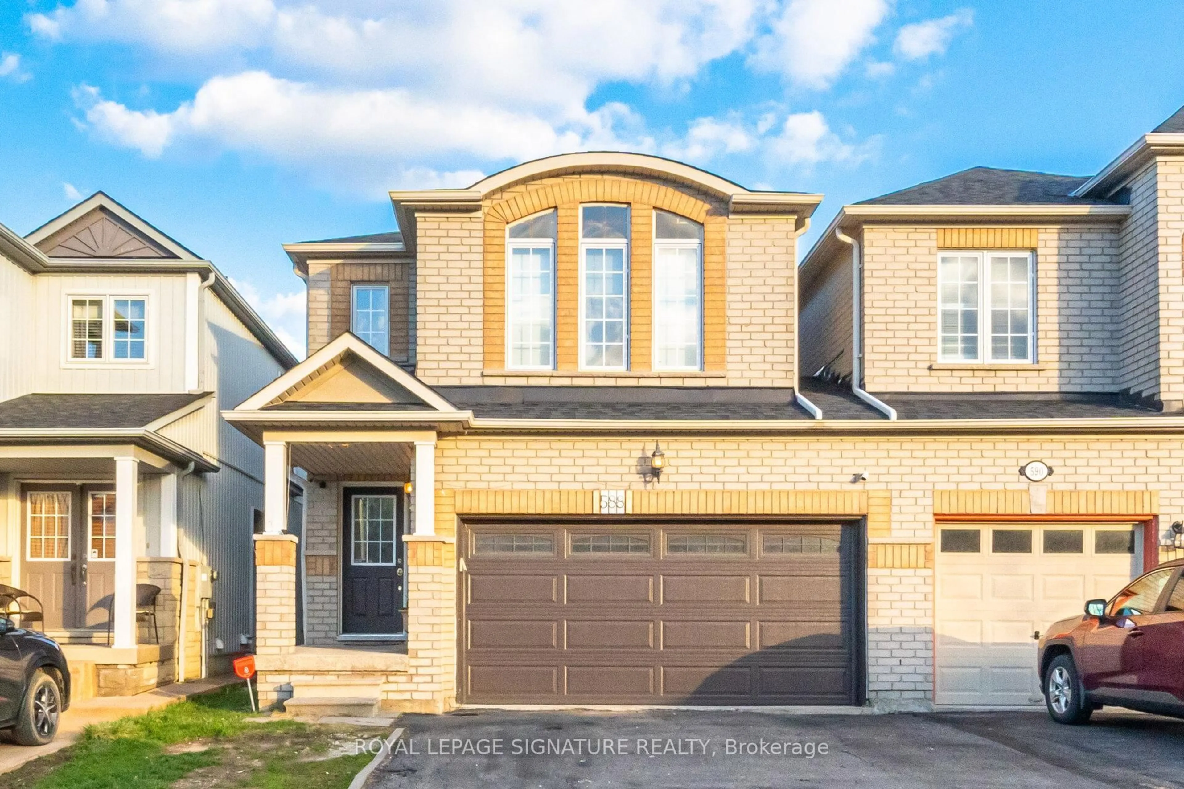 Home with brick exterior material, street for 588 Rossellini Dr, Mississauga Ontario L5W 1M4