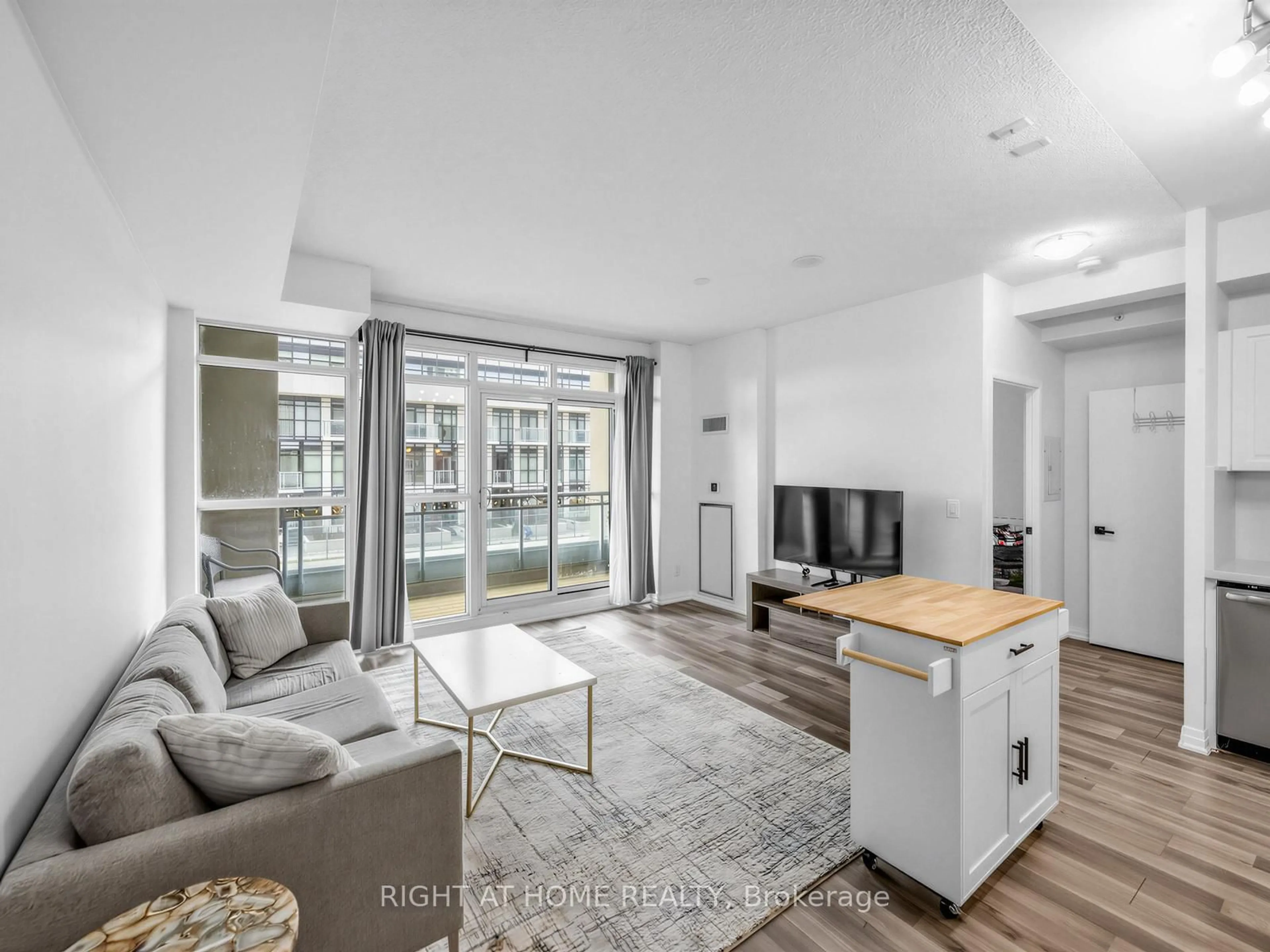 Living room with furniture, unknown for 155 Legion Rd #208, Toronto Ontario M8Y 0A7