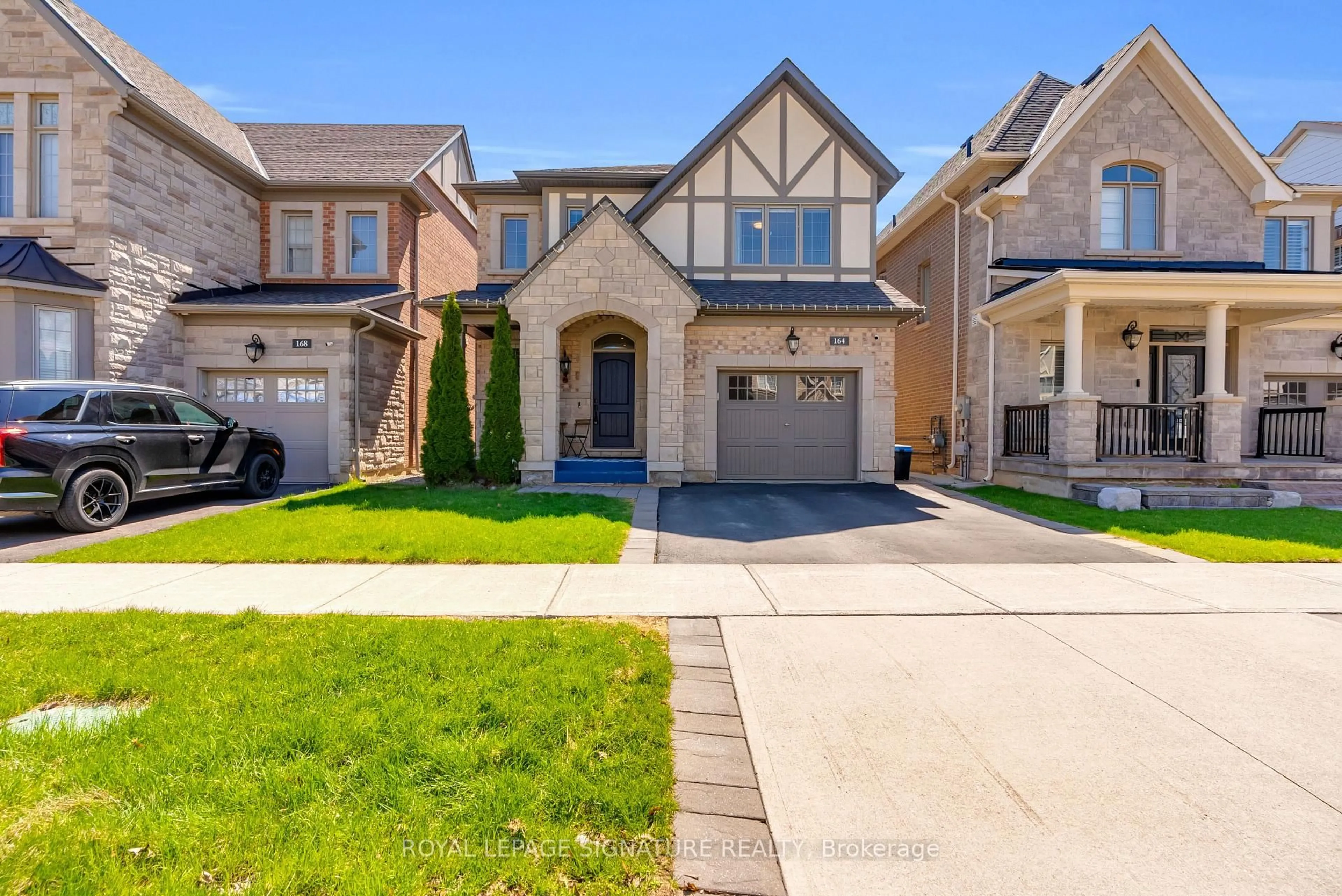 Home with brick exterior material, street for 164 Wheat Boom Dr, Oakville Ontario L6H 7C3