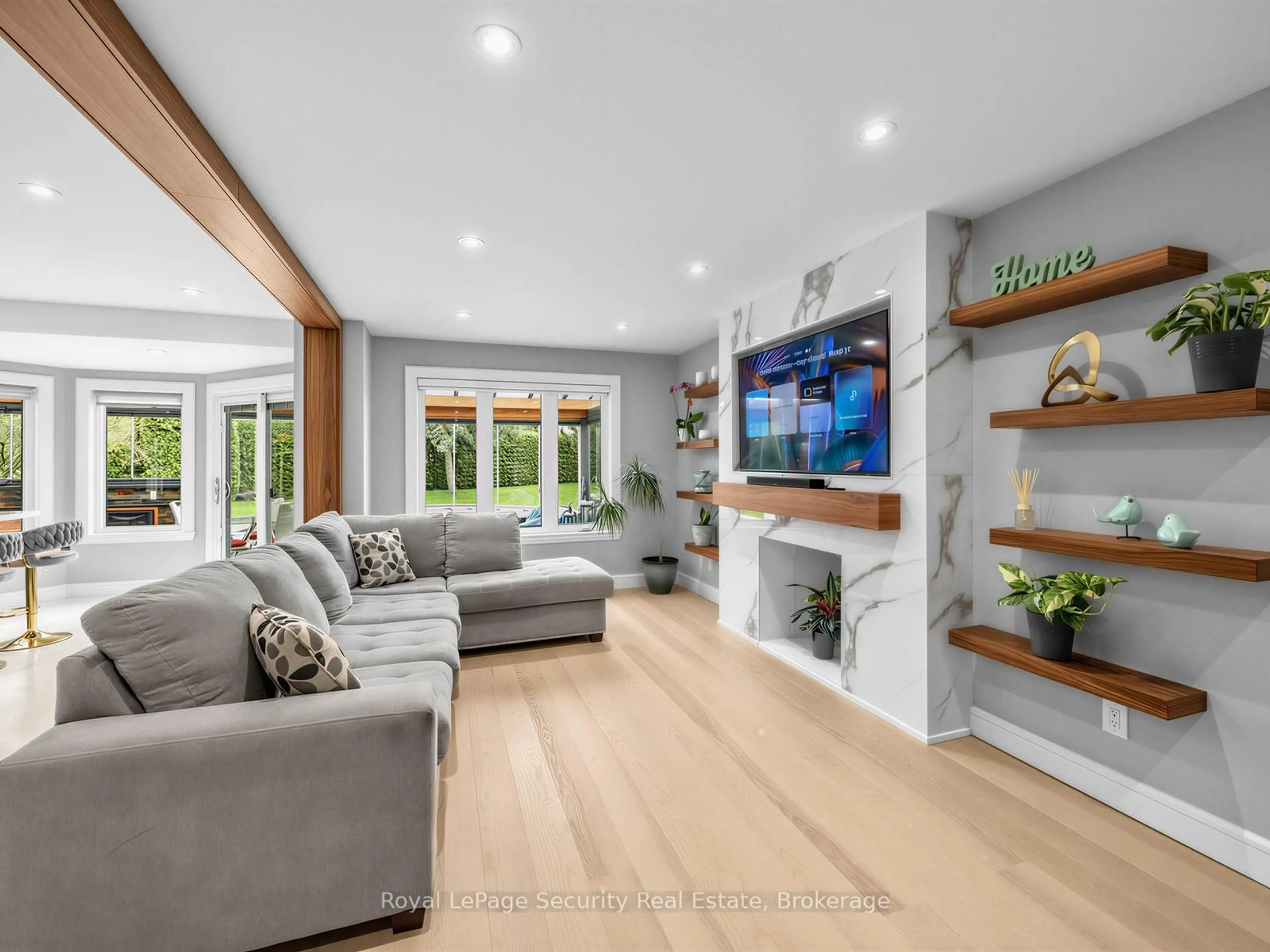 Living room with furniture, wood/laminate floor for 14 Jeremy Pl, Brampton Ontario L6S 5K6