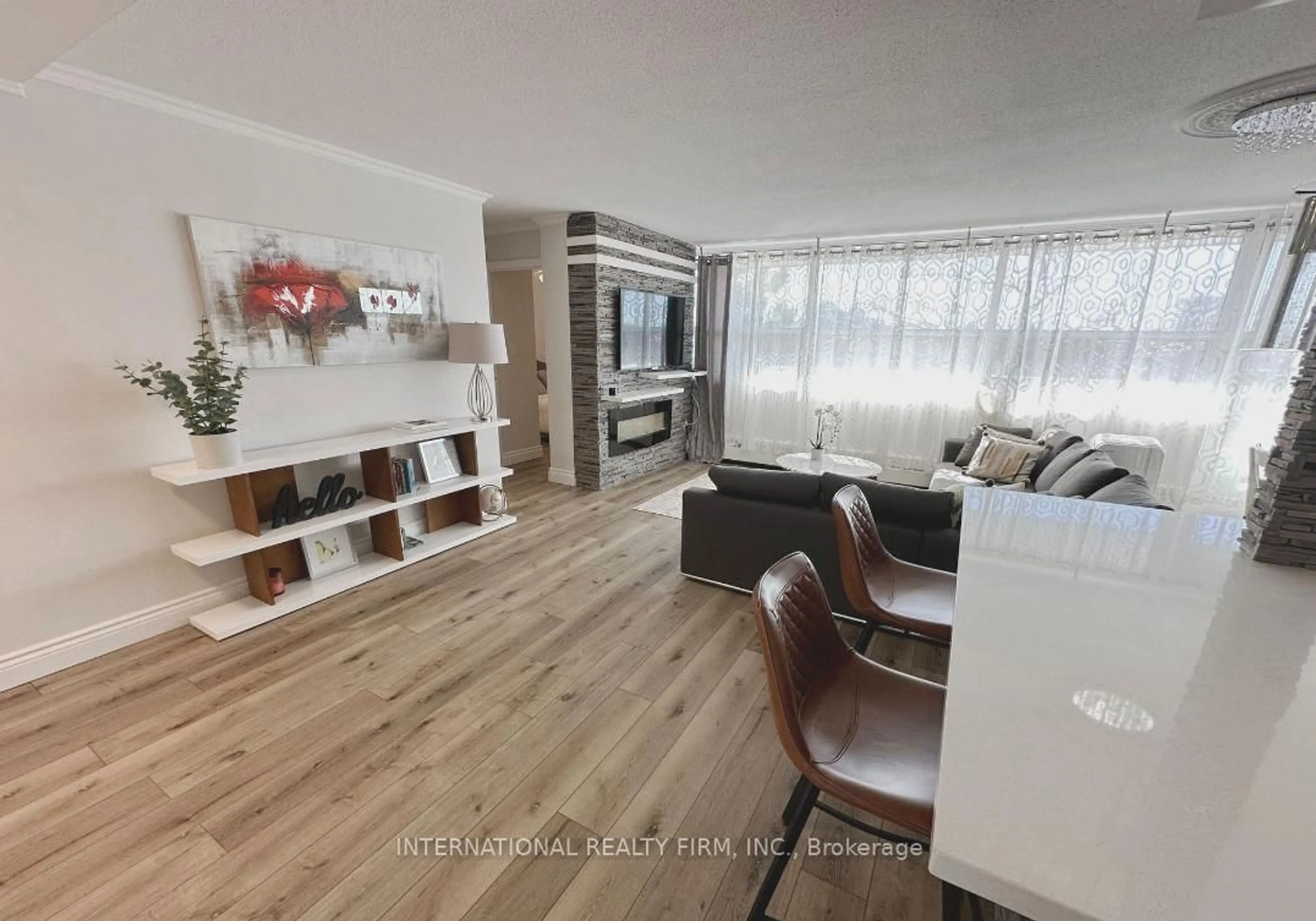 Living room with furniture, wood/laminate floor for 2263 Marine Dr #408, Oakville Ontario L6L 5K1