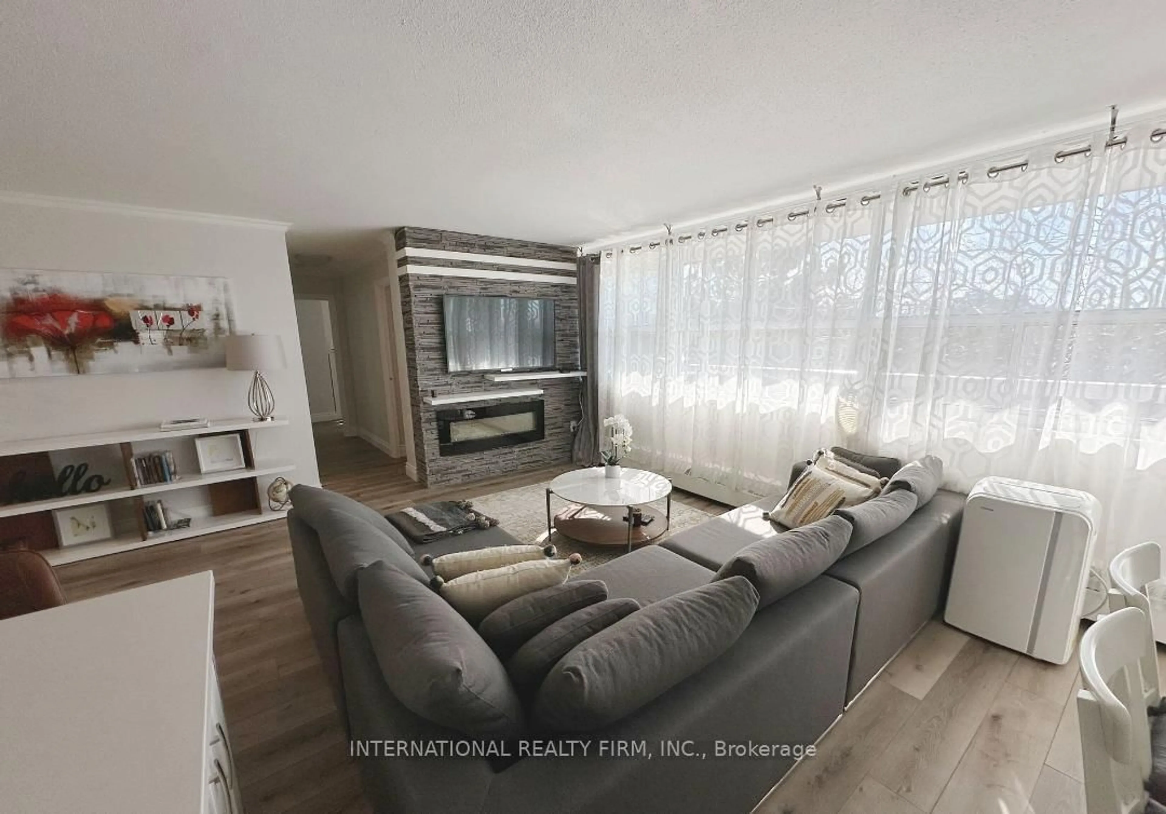 Living room with furniture, unknown for 2263 Marine Dr #408, Oakville Ontario L6L 5K1