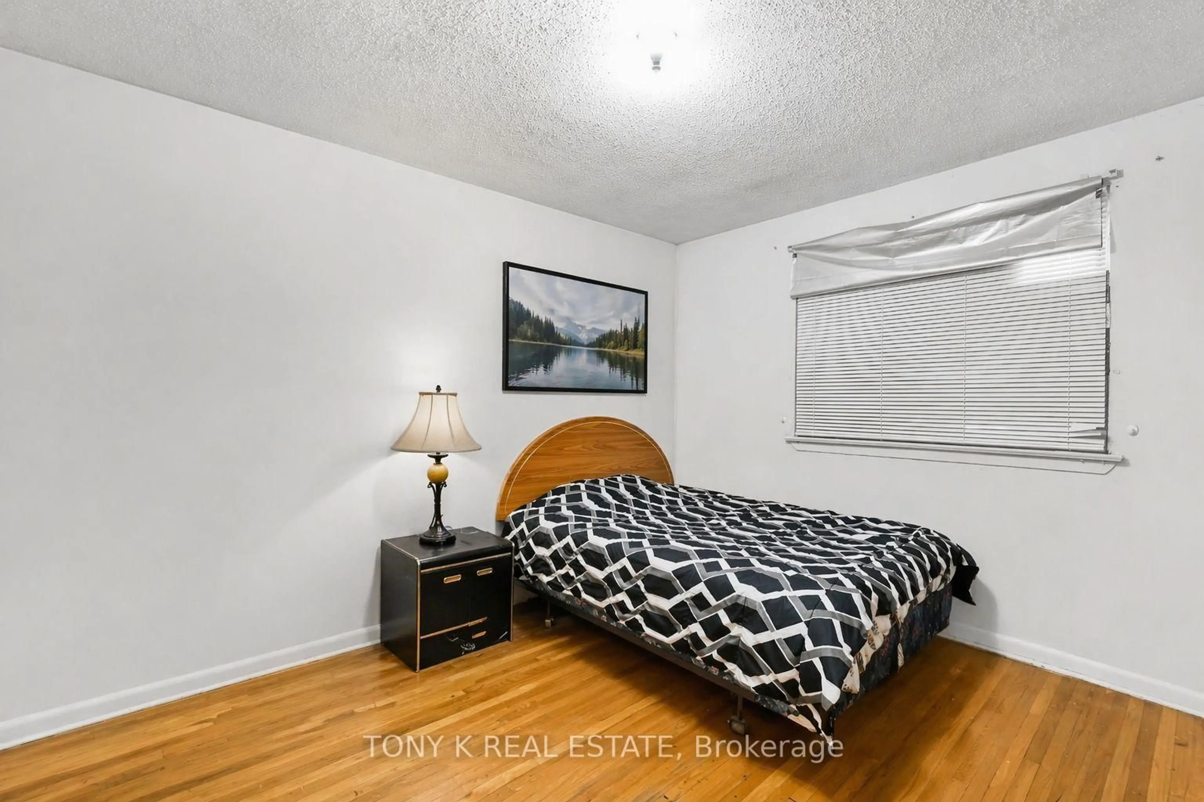 Bedroom with bed, wood/laminate floor for 3012 Keele St, Toronto Ontario M3M 2H3