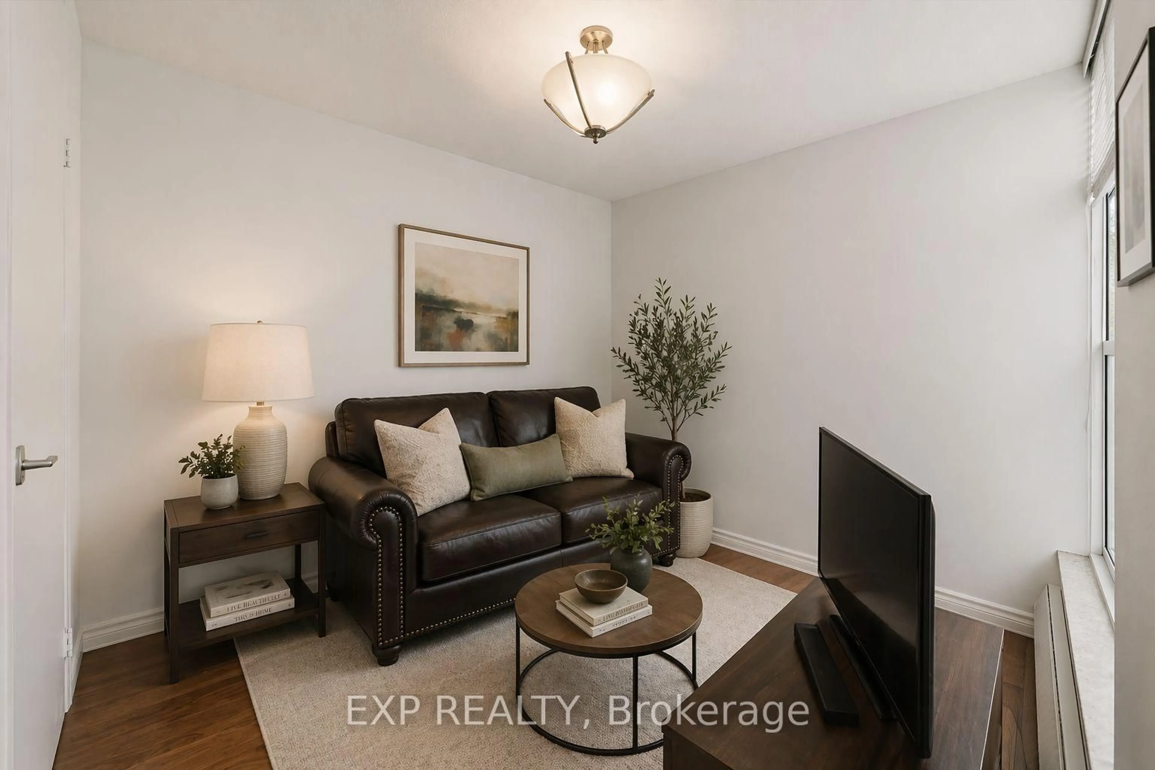 Living room with furniture, wood/laminate floor for 60 Southport St #617, Toronto Ontario M6S 3N4