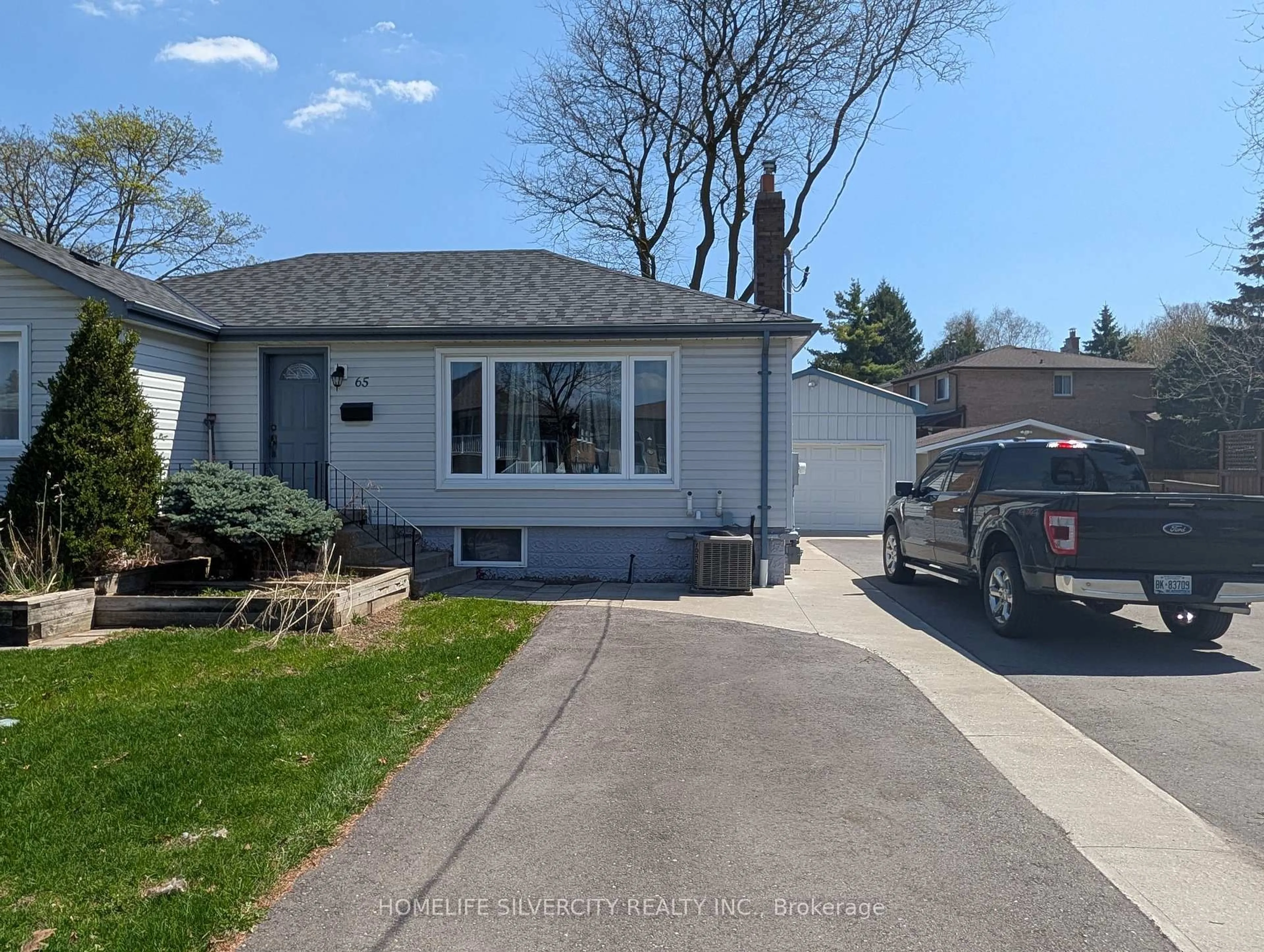 Home with vinyl exterior material, street for 65 English St, Brampton Ontario L6X 1L5