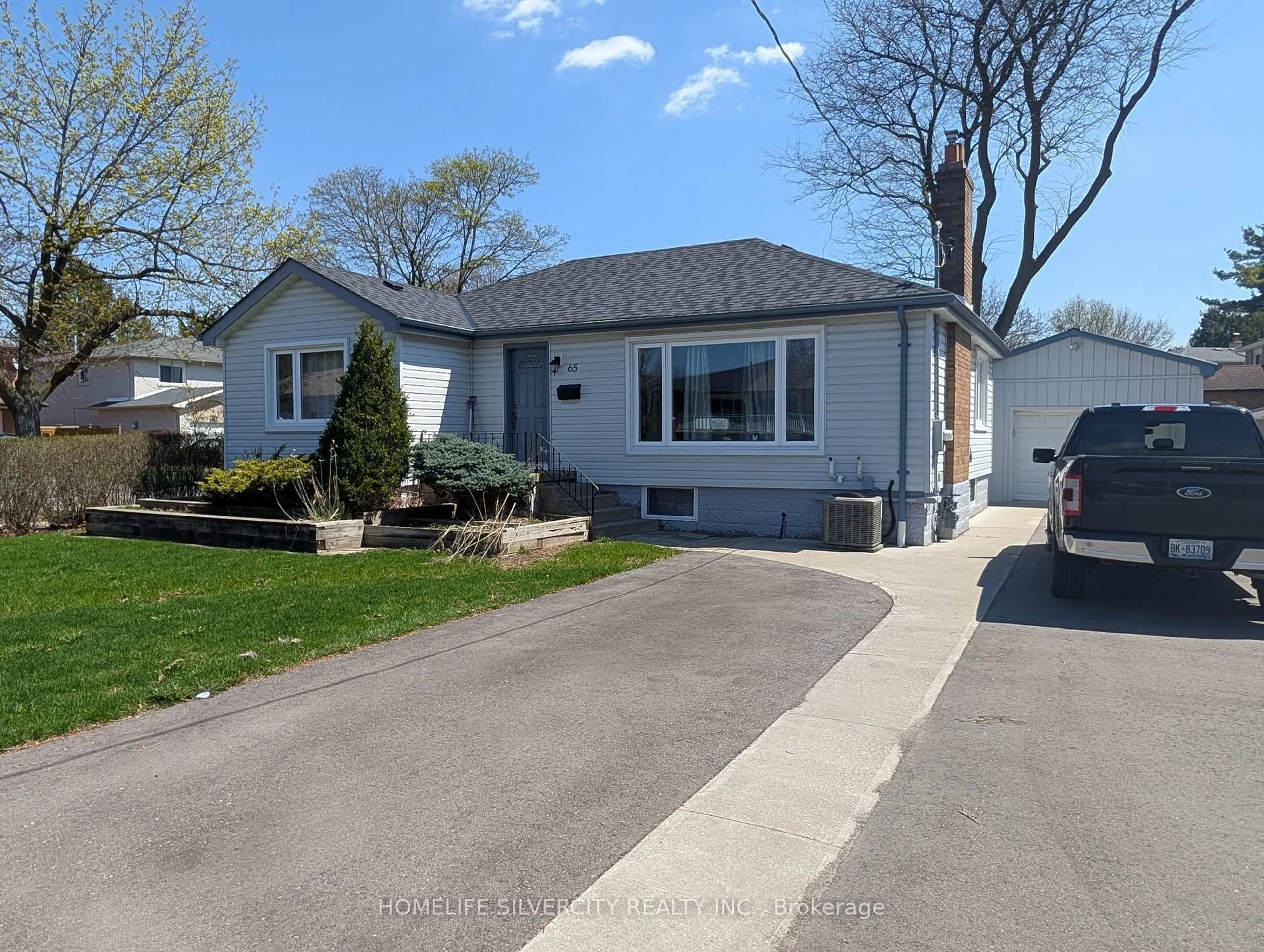 Home with vinyl exterior material, street for 65 English St, Brampton Ontario L6X 1L5