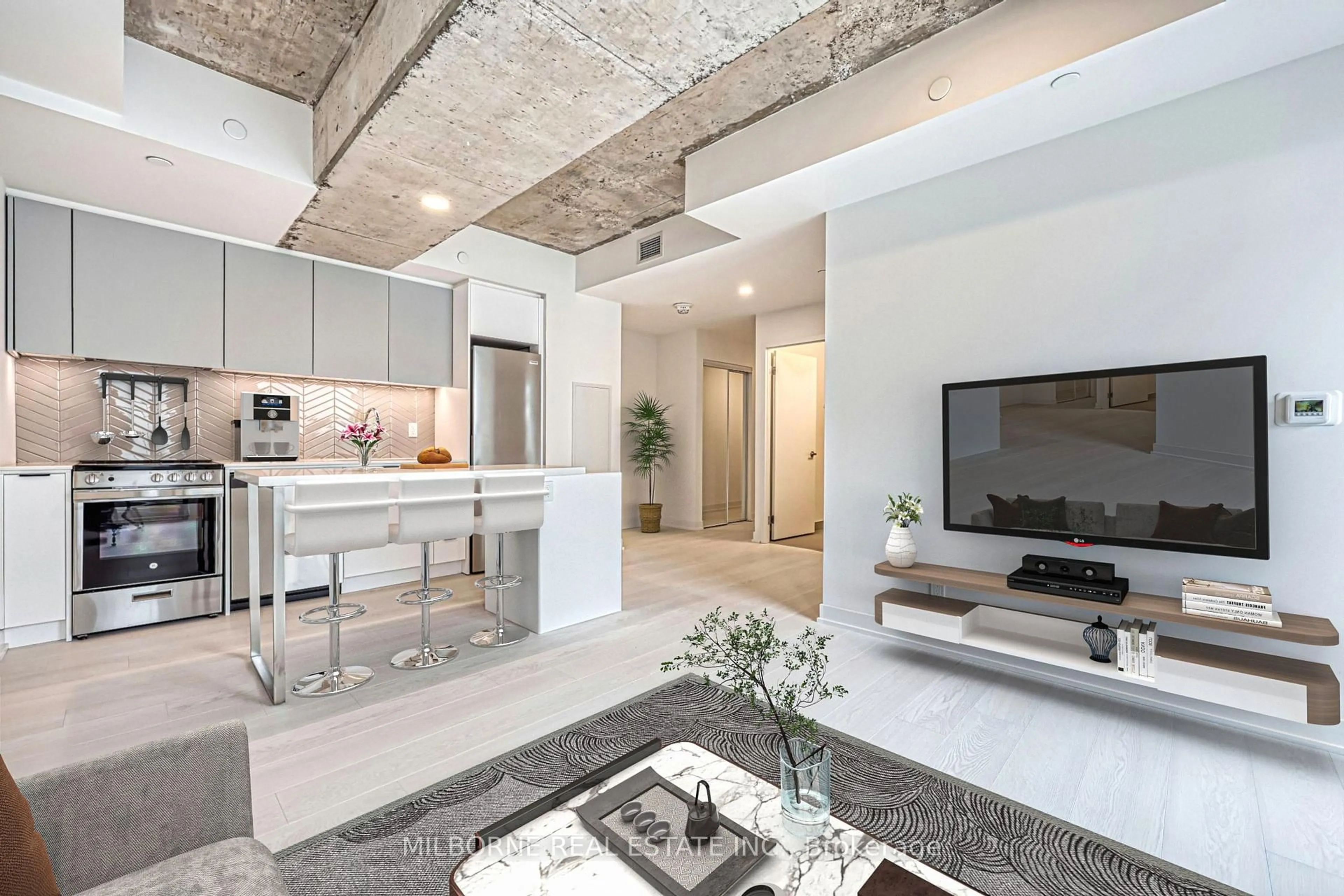 Open concept kitchen, cement floor for 57 Brock Ave #104, Toronto Ontario M3H 3N2