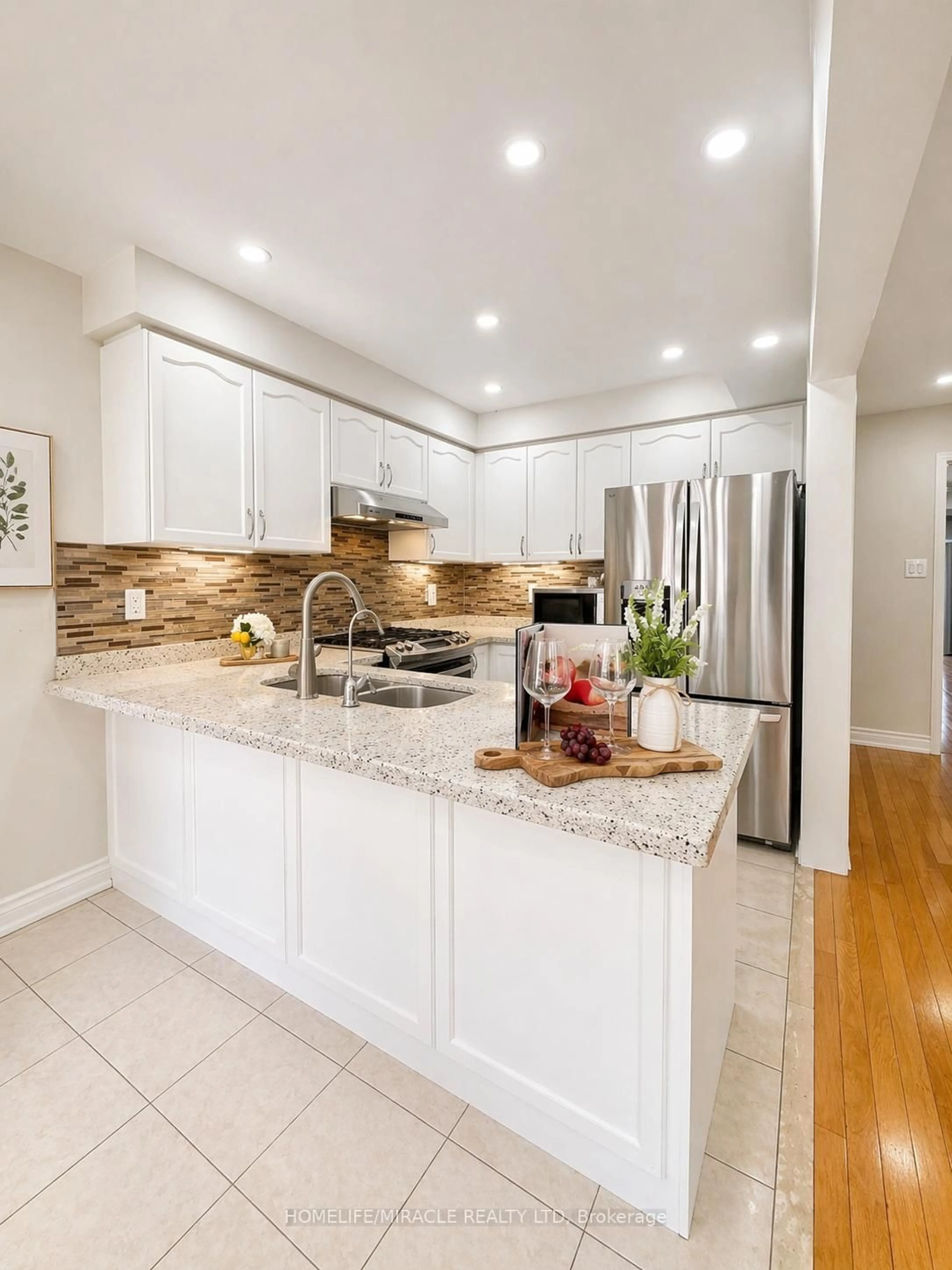 Open concept kitchen, ceramic/tile floor for 65 Bellchase Tr, Brampton Ontario L6P 3L9