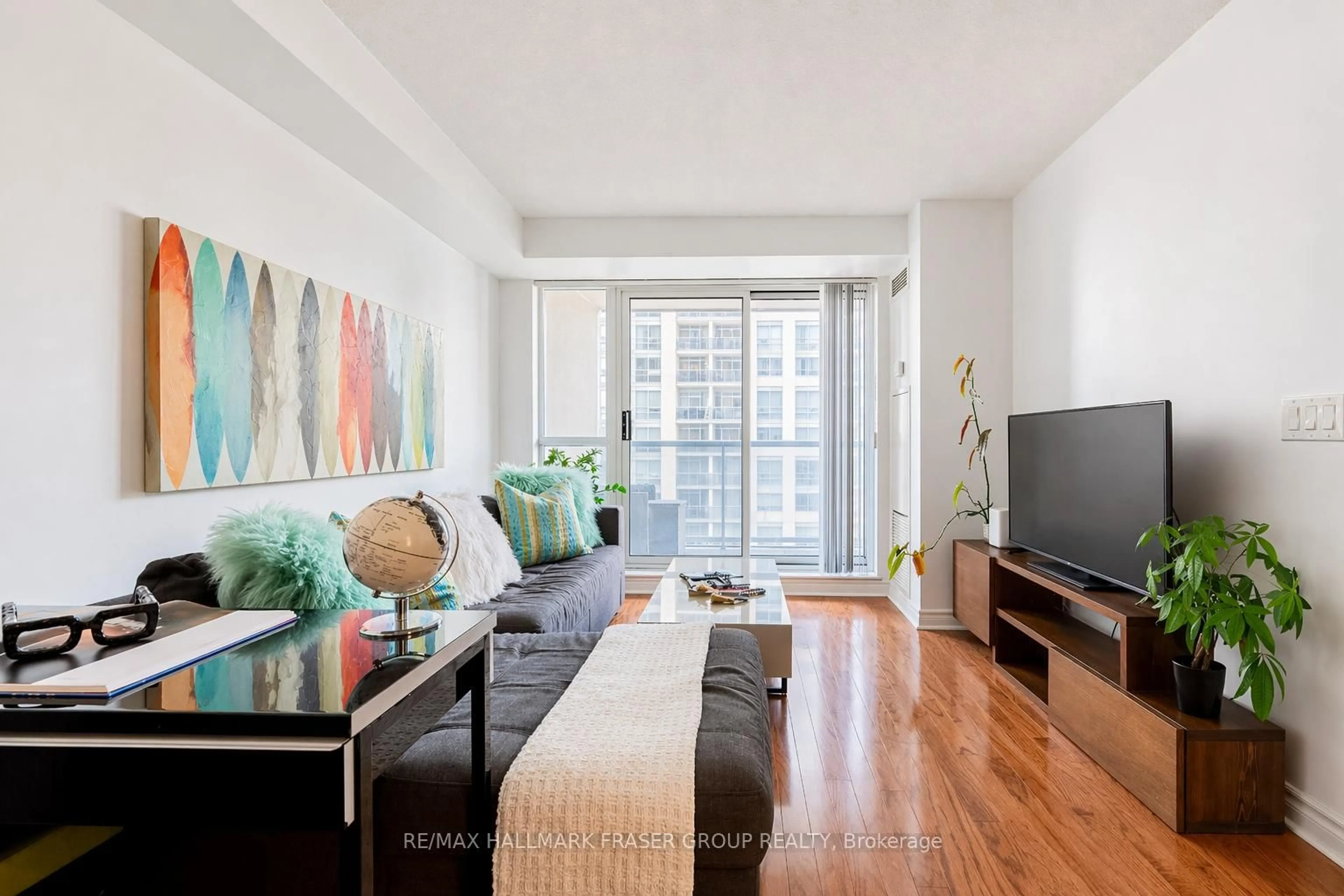 Living room with furniture, wood/laminate floor for 5 Michael Power Pl #905, Toronto Ontario M9A 0A3