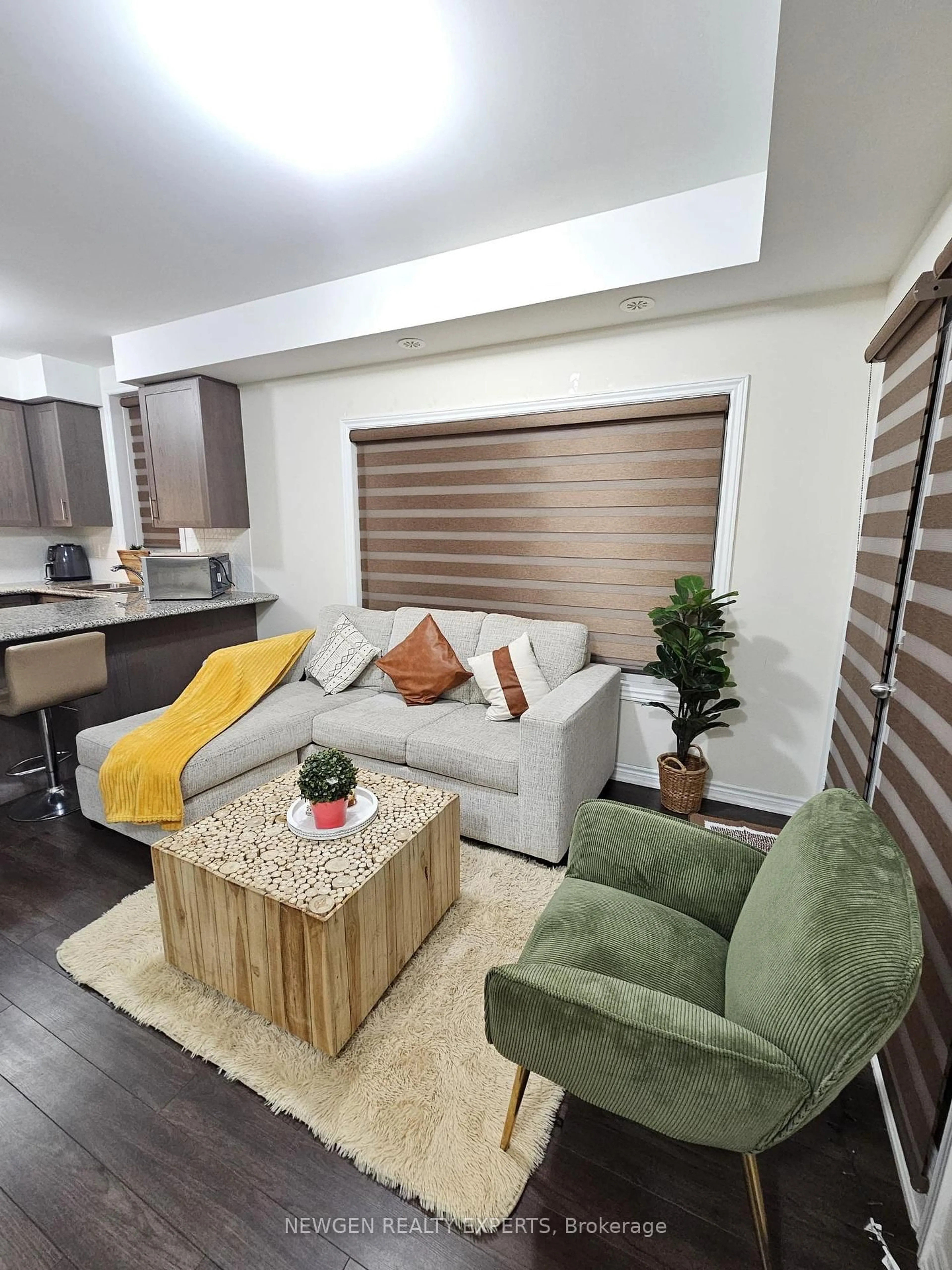 Living room with furniture, wood/laminate floor for 40 Halliford Pl #509, Brampton Ontario L6P 4R1