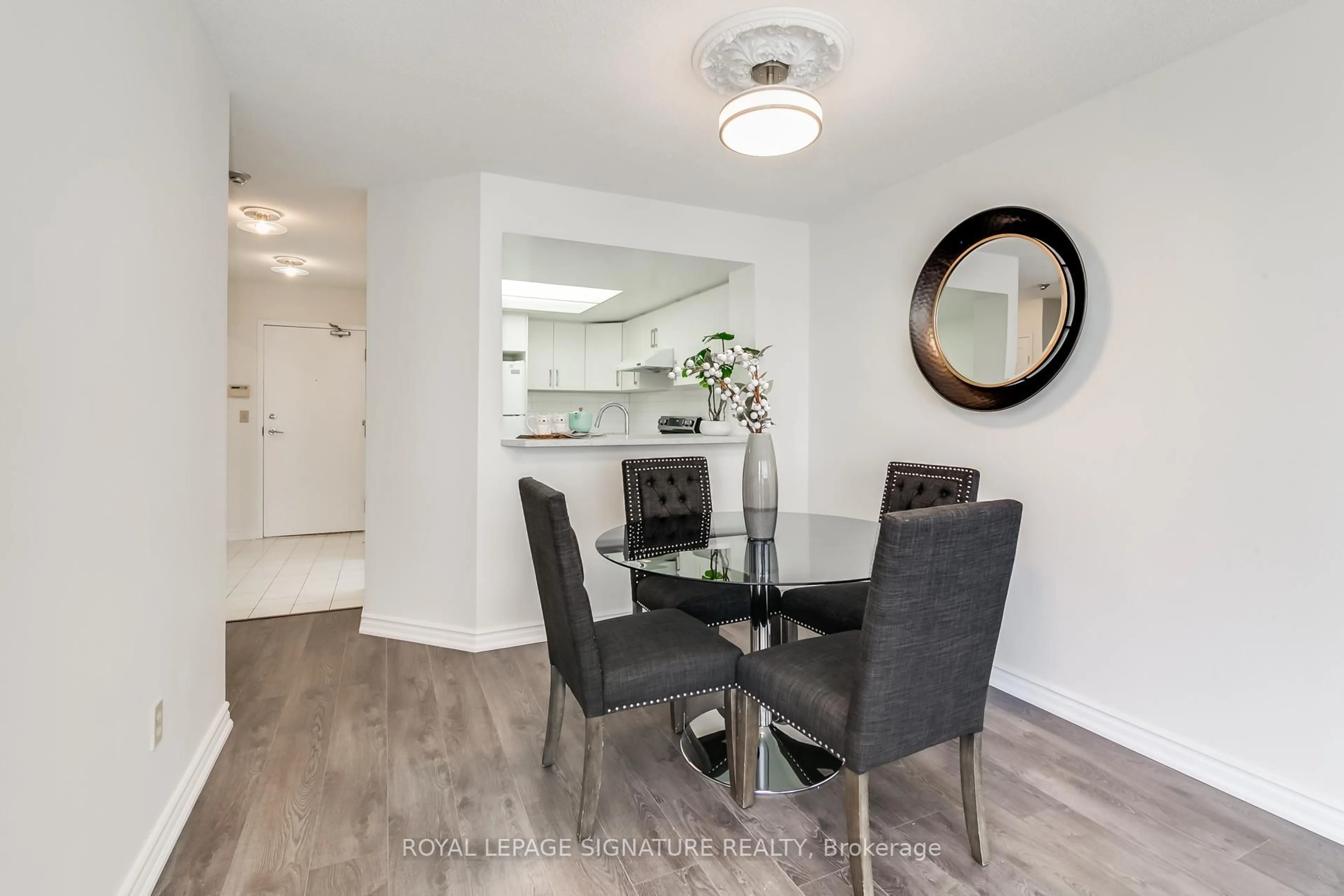 Dining room, wood/laminate floor for 325 Webb Dr #707, Mississauga Ontario L5B 3Z9