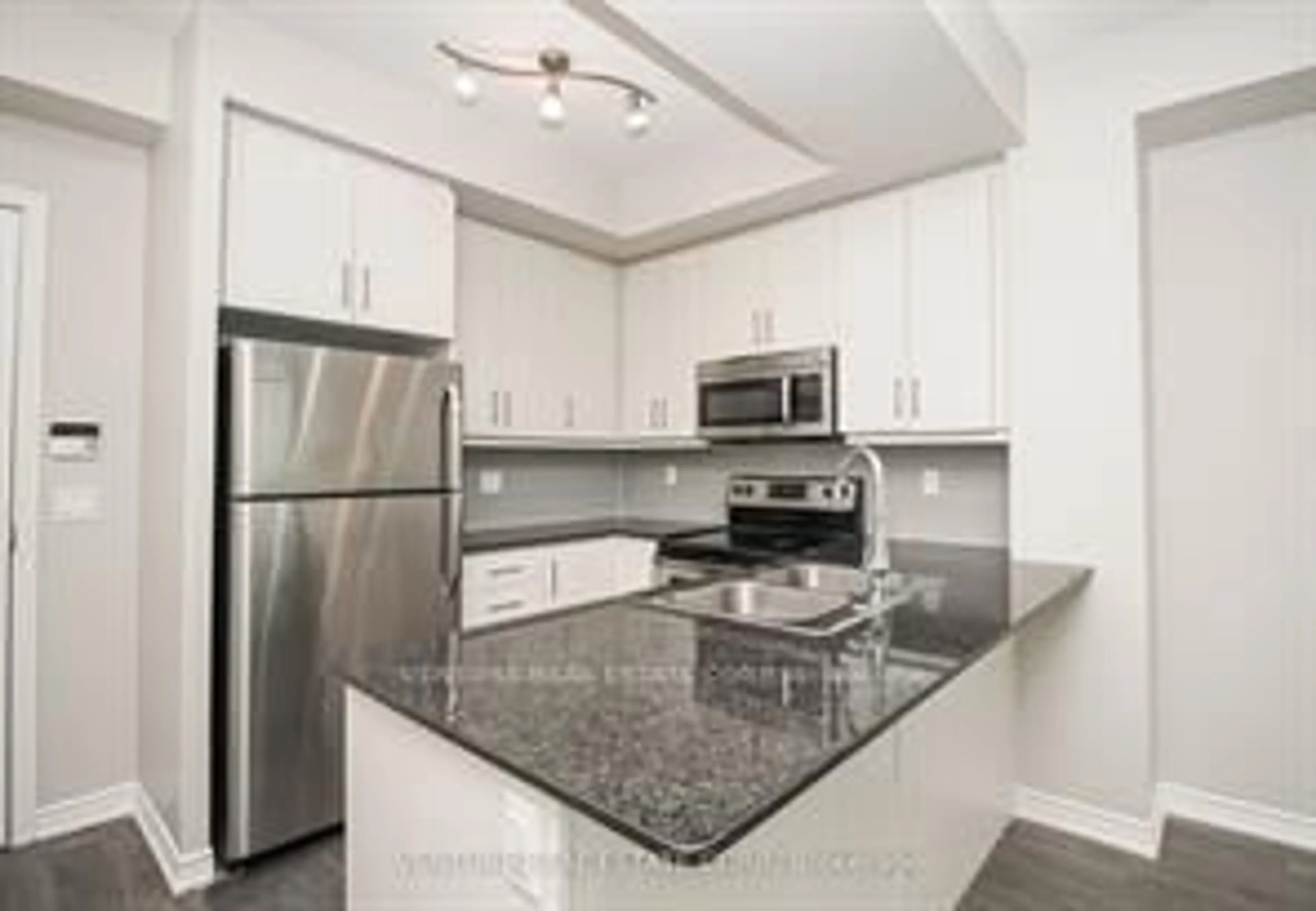 Standard kitchen, unknown for 15 James Finlay Way #824, Toronto Ontario M3M 0B3