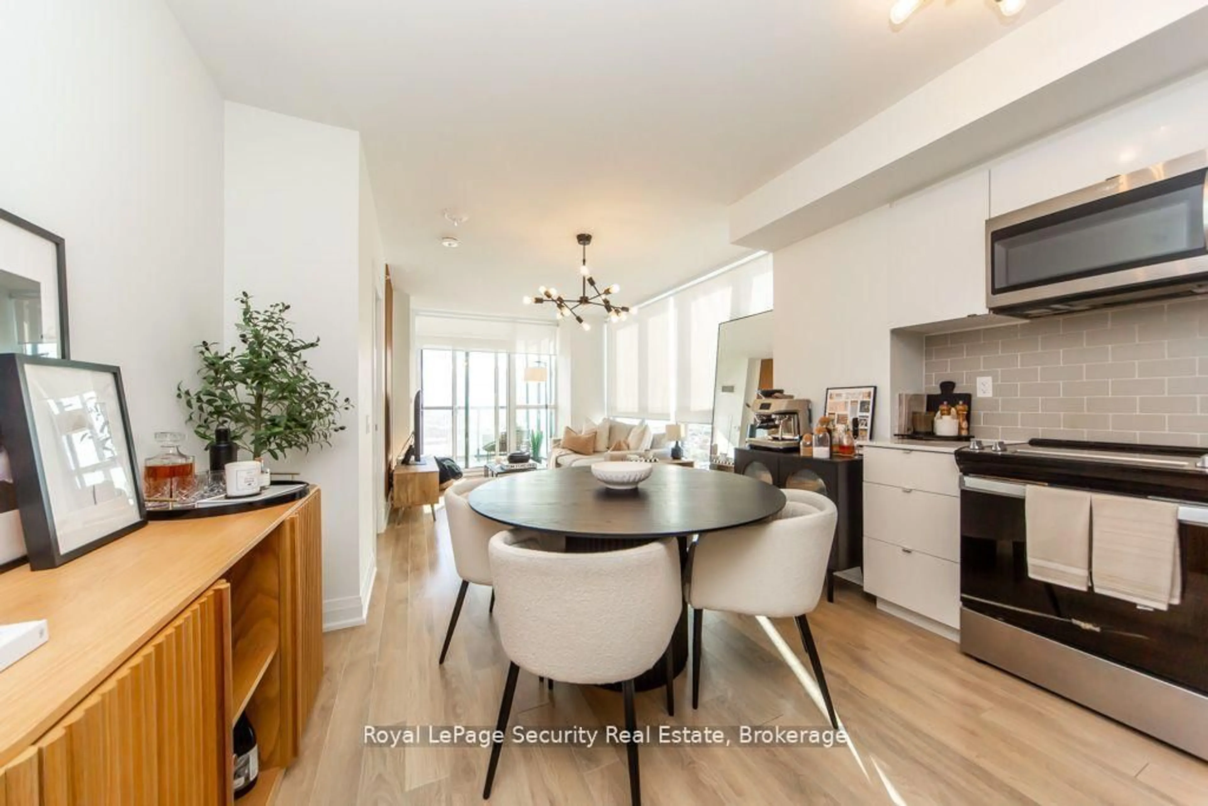 Open concept kitchen, wood/laminate floor for 1461 Lawrence Ave #2009, Toronto Ontario M6L 0A6