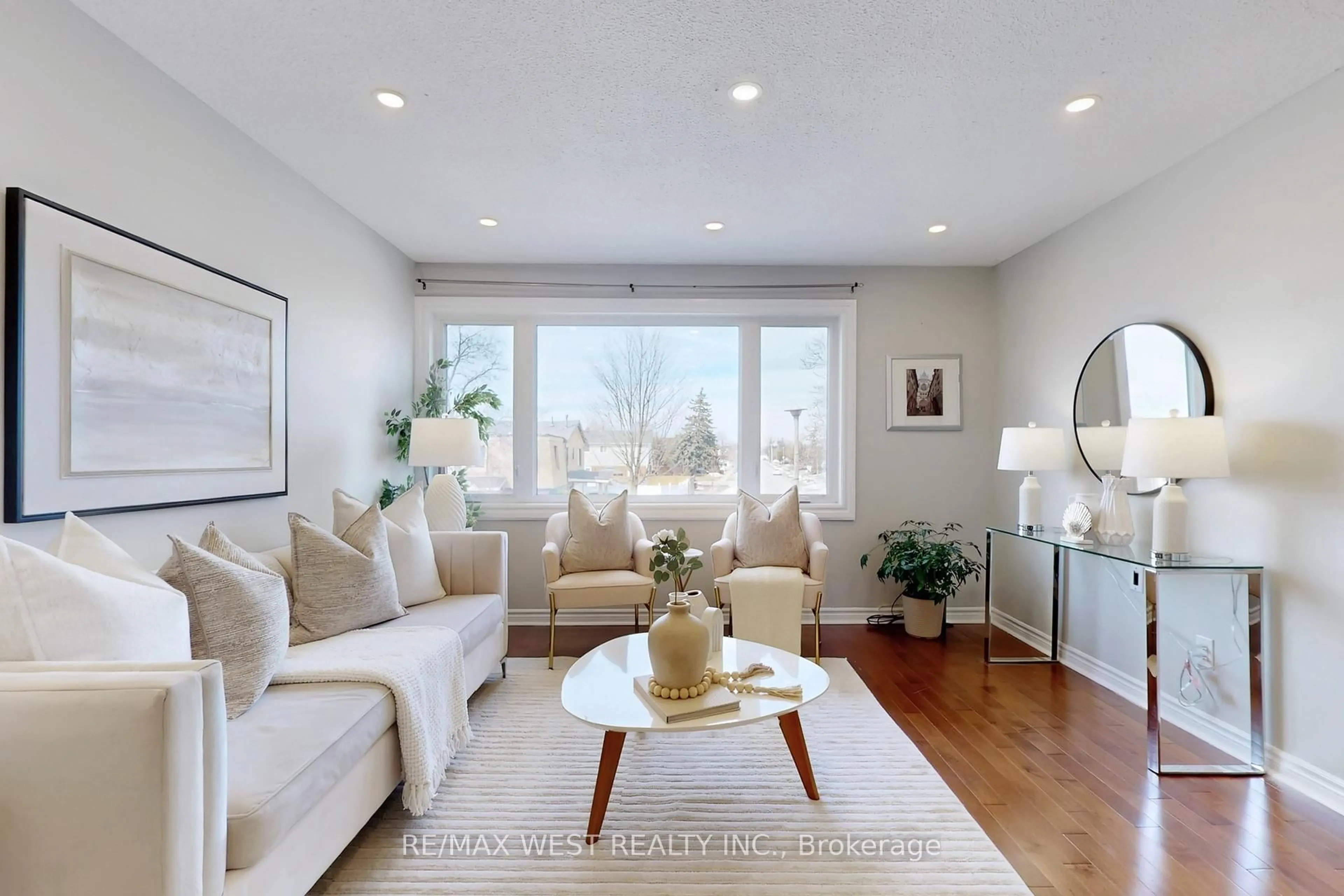 Living room with furniture, wood/laminate floor for 113 Kingswood Dr, Brampton Ontario L6V 2X5