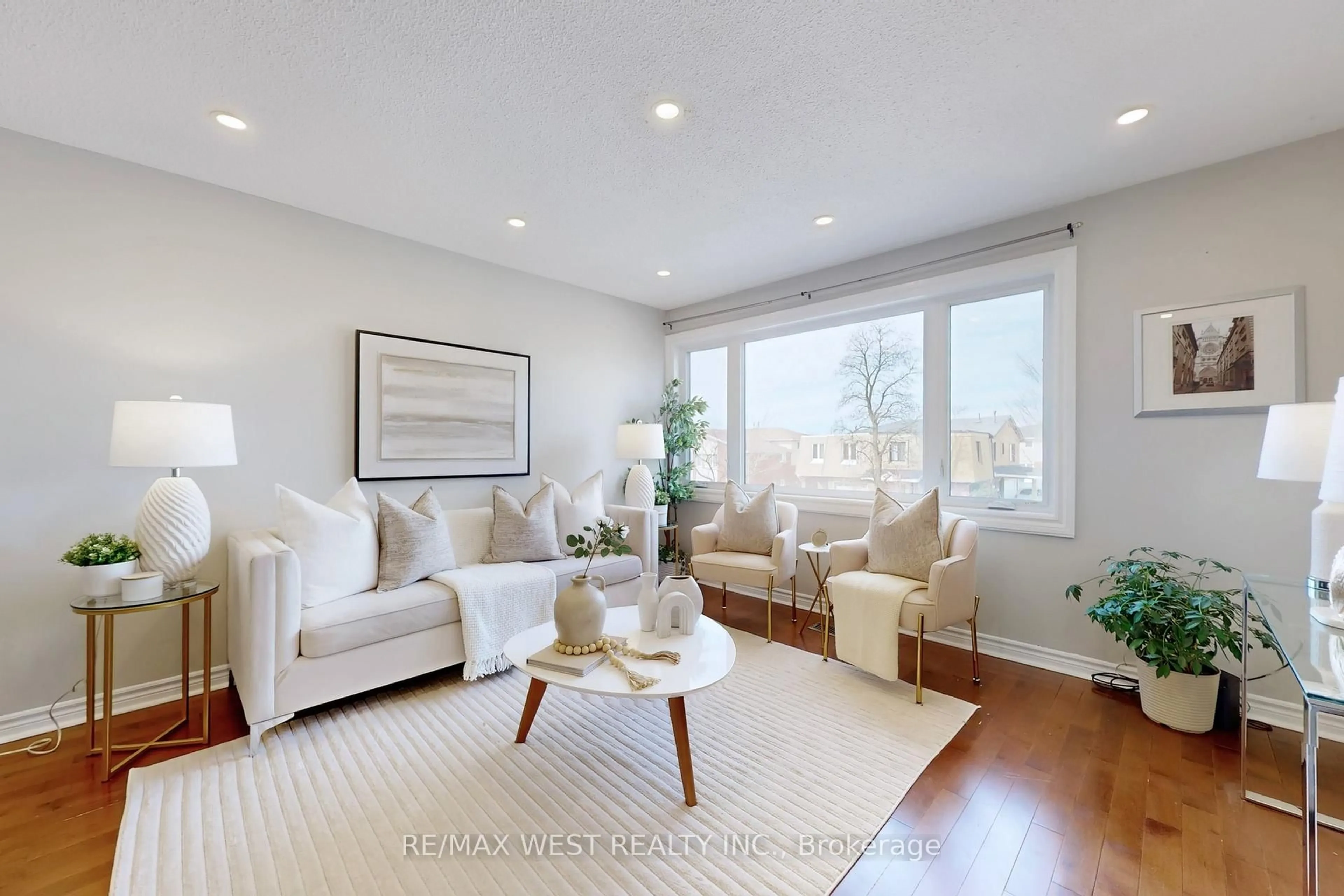 Living room with furniture, wood/laminate floor for 113 Kingswood Dr, Brampton Ontario L6V 2X5