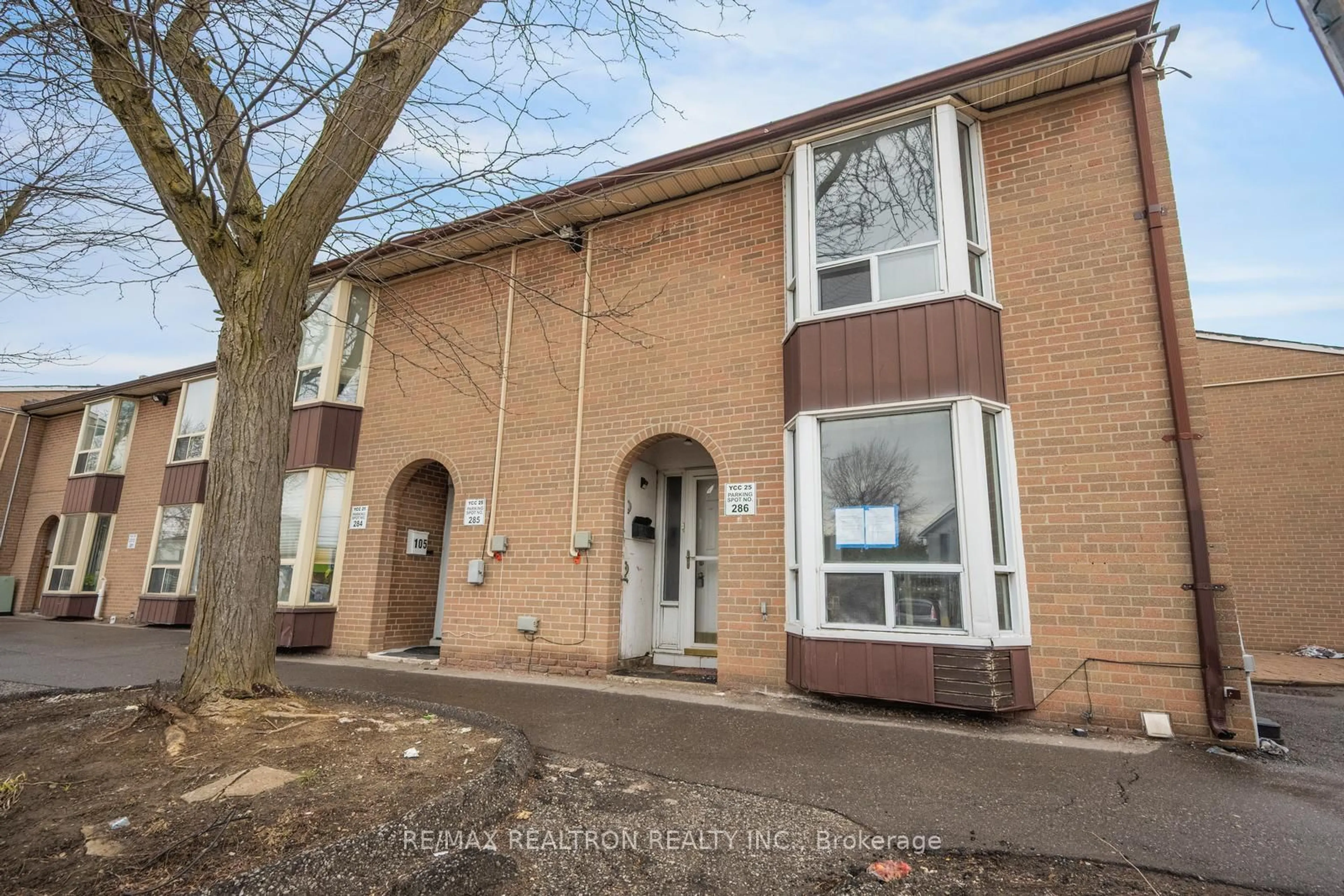 A pic from outside/outdoor area/front of a property/back of a property/a pic from drone, street for 250 John Garland Blvd #106, Toronto Ontario M9V 1N8
