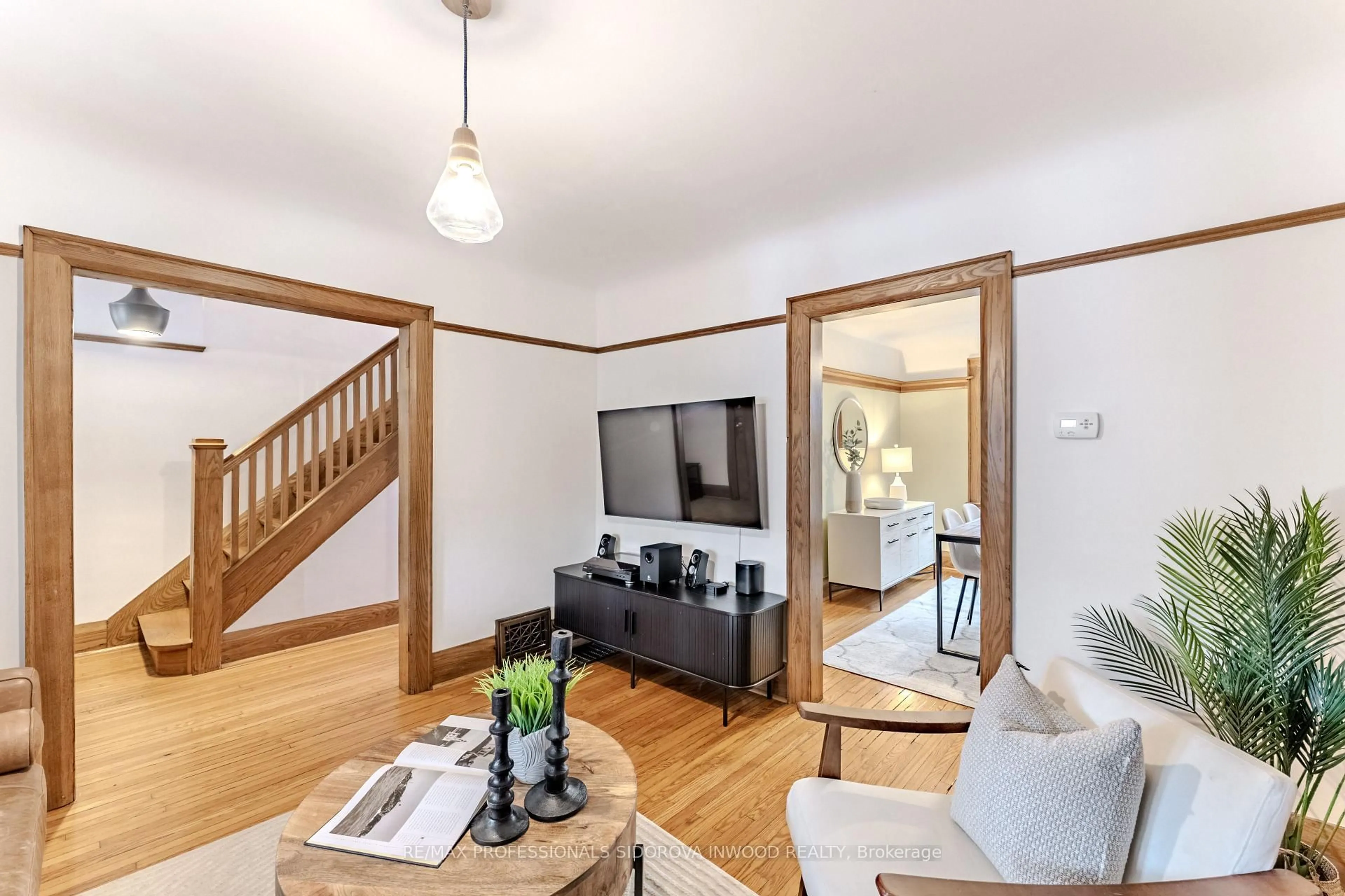 Living room with furniture, wood/laminate floor for 16 Howick Ave, Toronto Ontario M6N 1M8