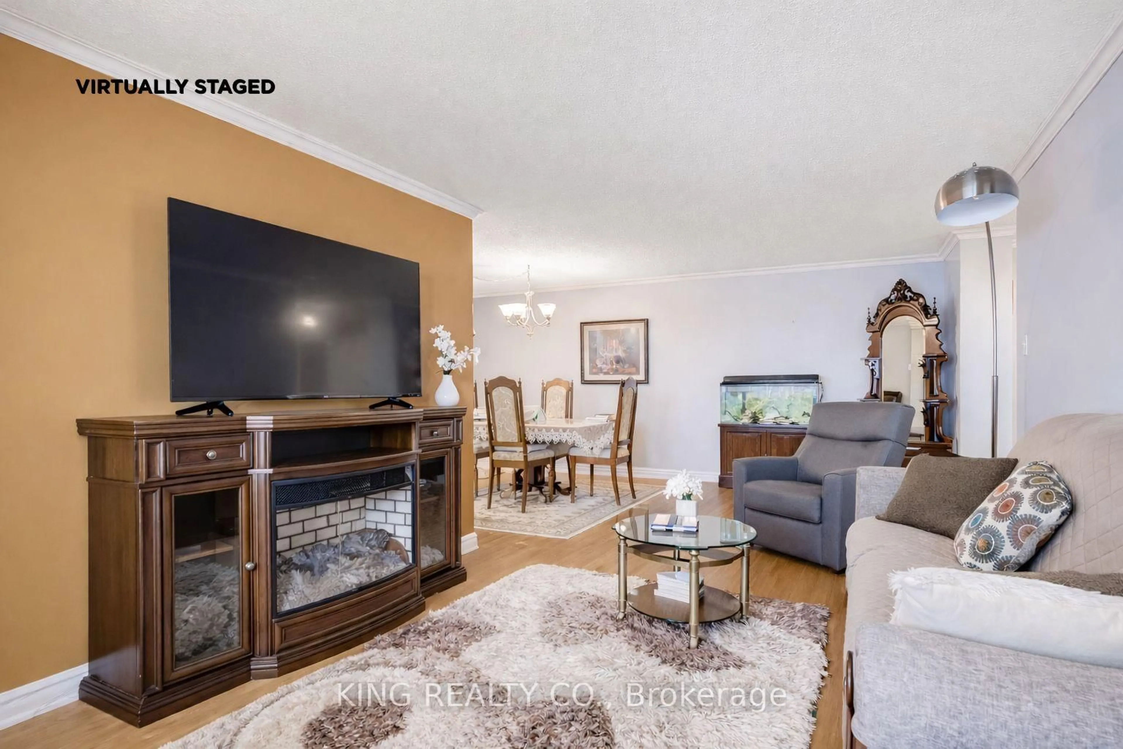 Living room with furniture, wood/laminate floor for 5 Lisa St #1601, Brampton Ontario L6T 4T4