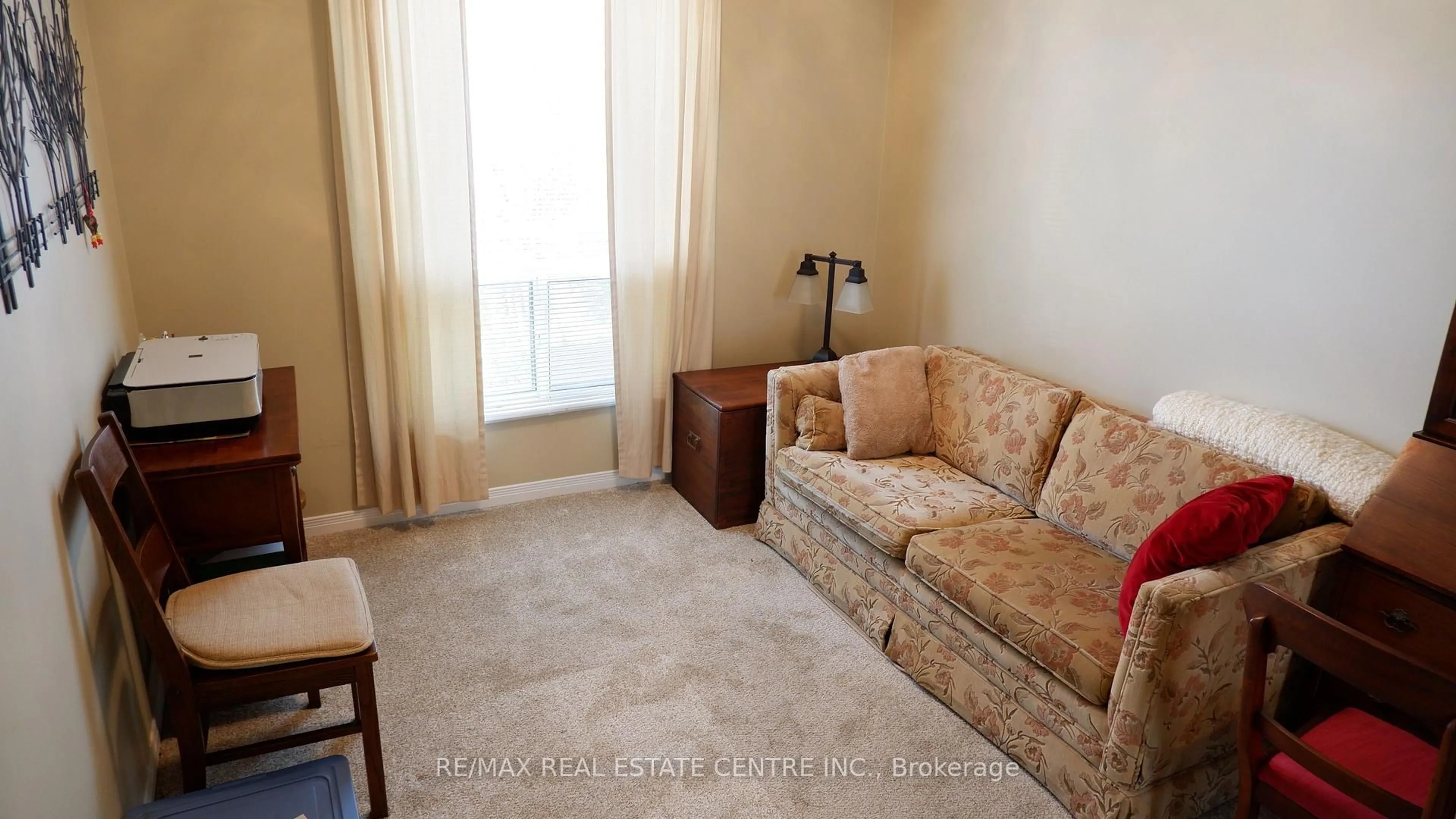 Living room with furniture, unknown for 24 Chapel St #105, Halton Hills Ontario L7G 6A7