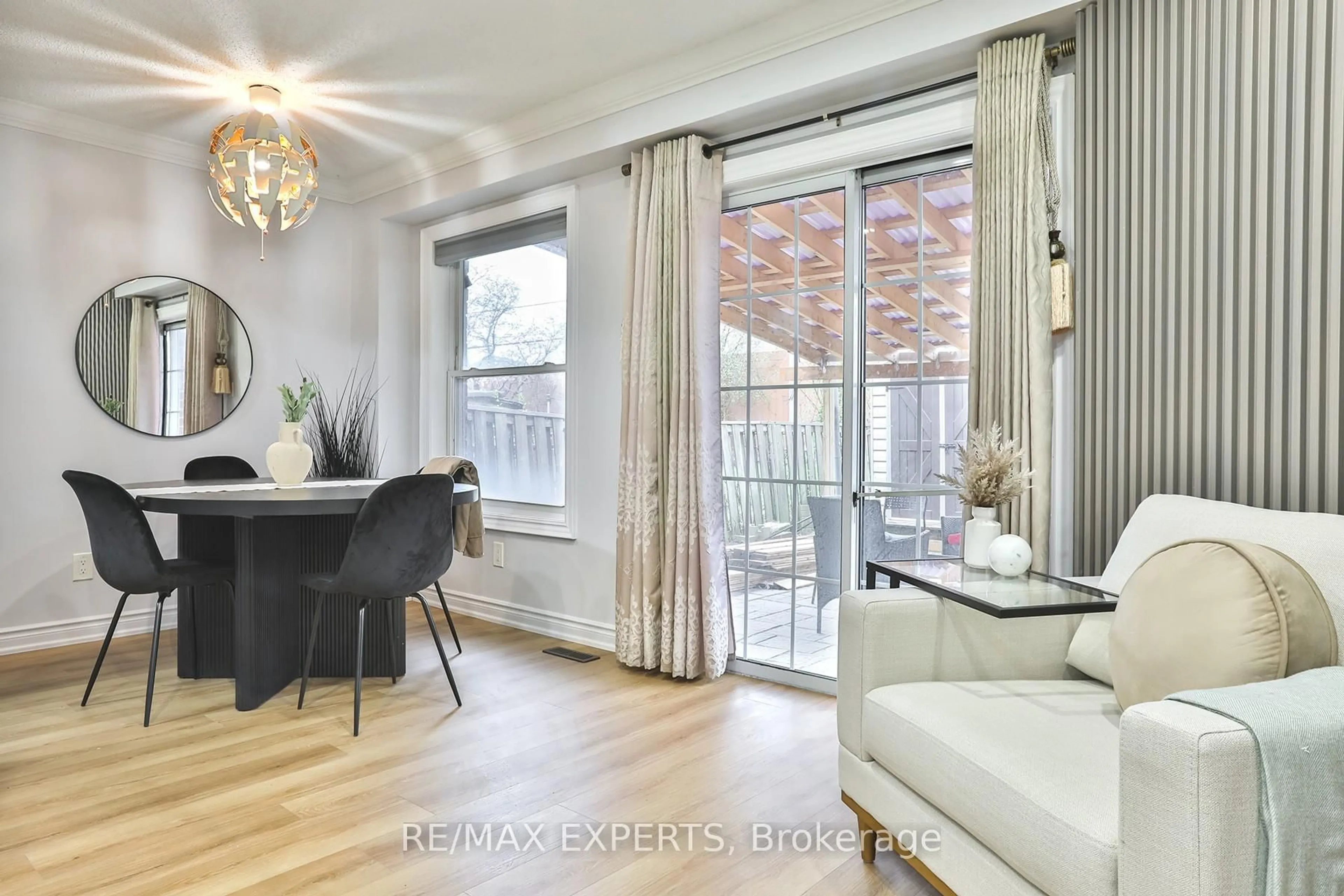 Living room with furniture, wood/laminate floor for 16 Hetherington Pl, Brampton Ontario L6S 5M7