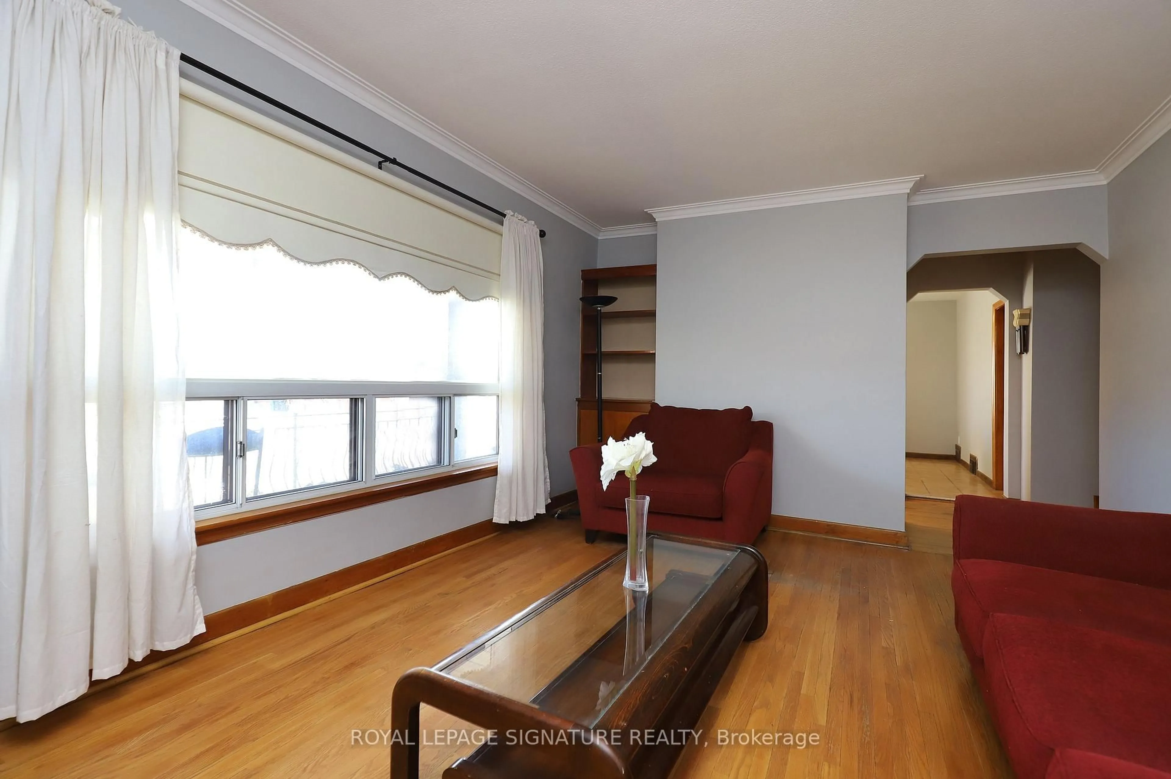 Living room with furniture, wood/laminate floor for 56 Wendell Ave, Toronto Ontario M9N 3K7