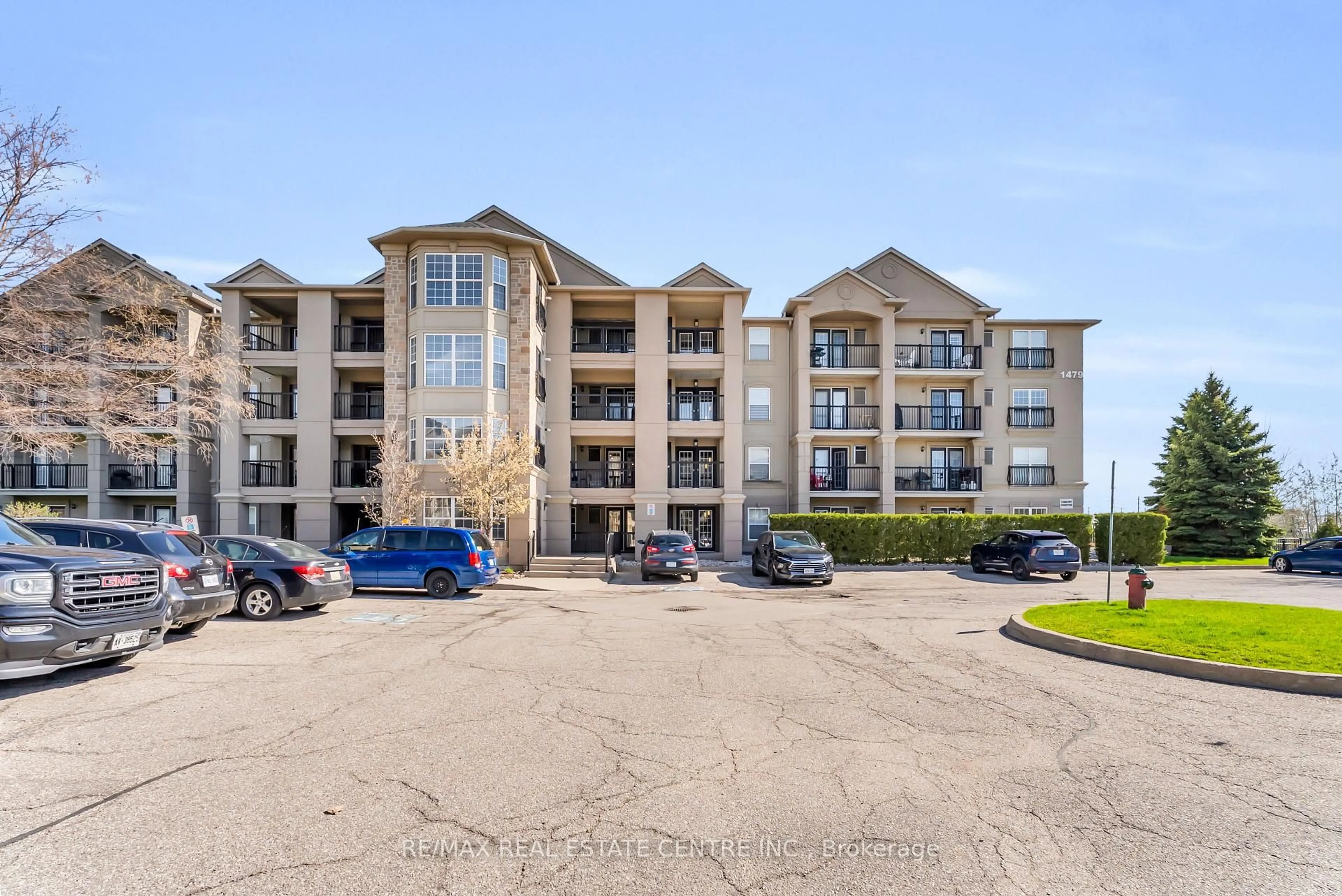 A pic from outside/outdoor area/front of a property/back of a property/a pic from drone, water/lake/river/ocean view for 1479 Maple Ave #102, Milton Ontario L9T 0B5
