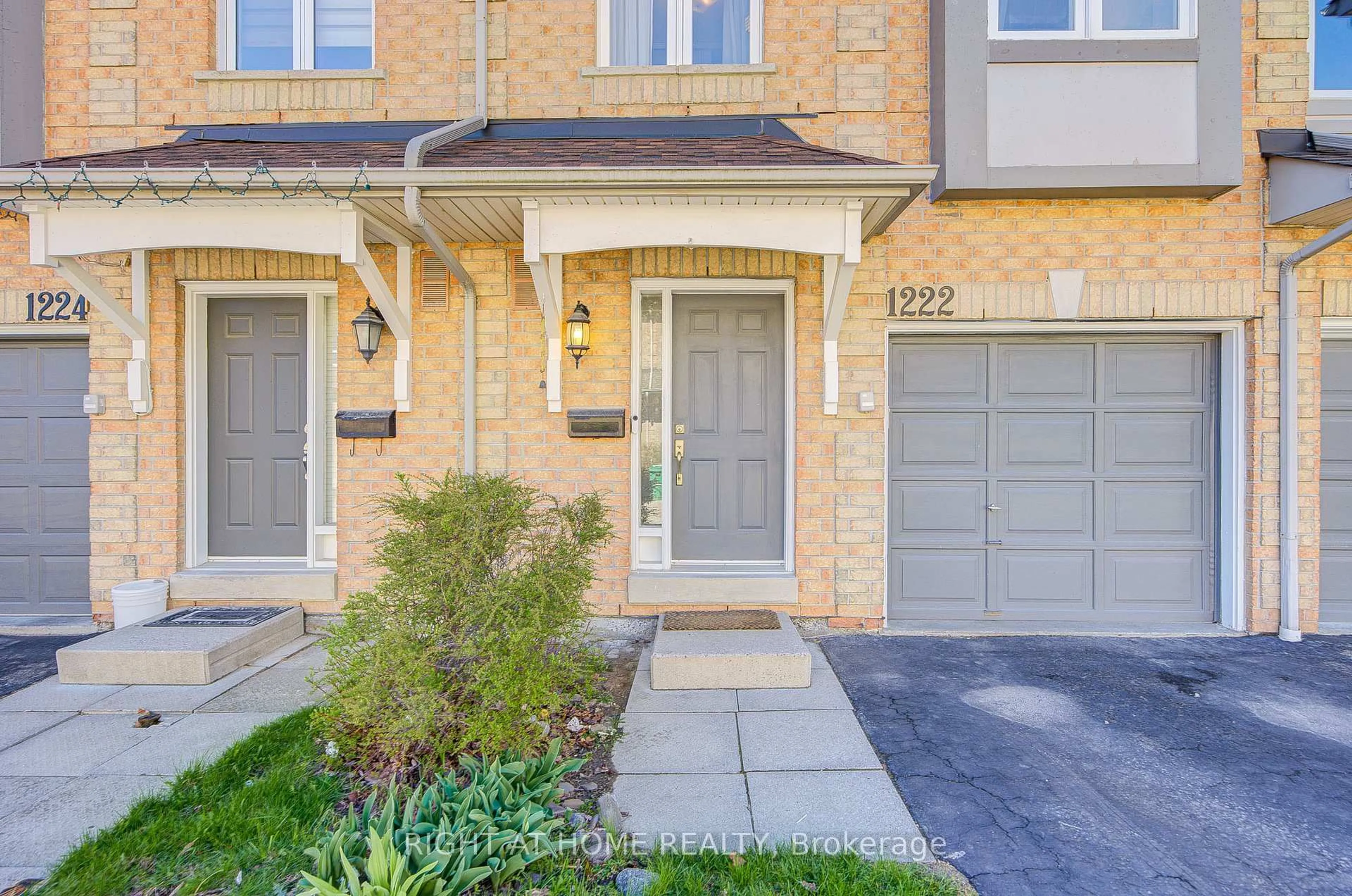 Home with brick exterior material, street for 1222 Parkwest Pl #34, Mississauga Ontario L5E 3K9