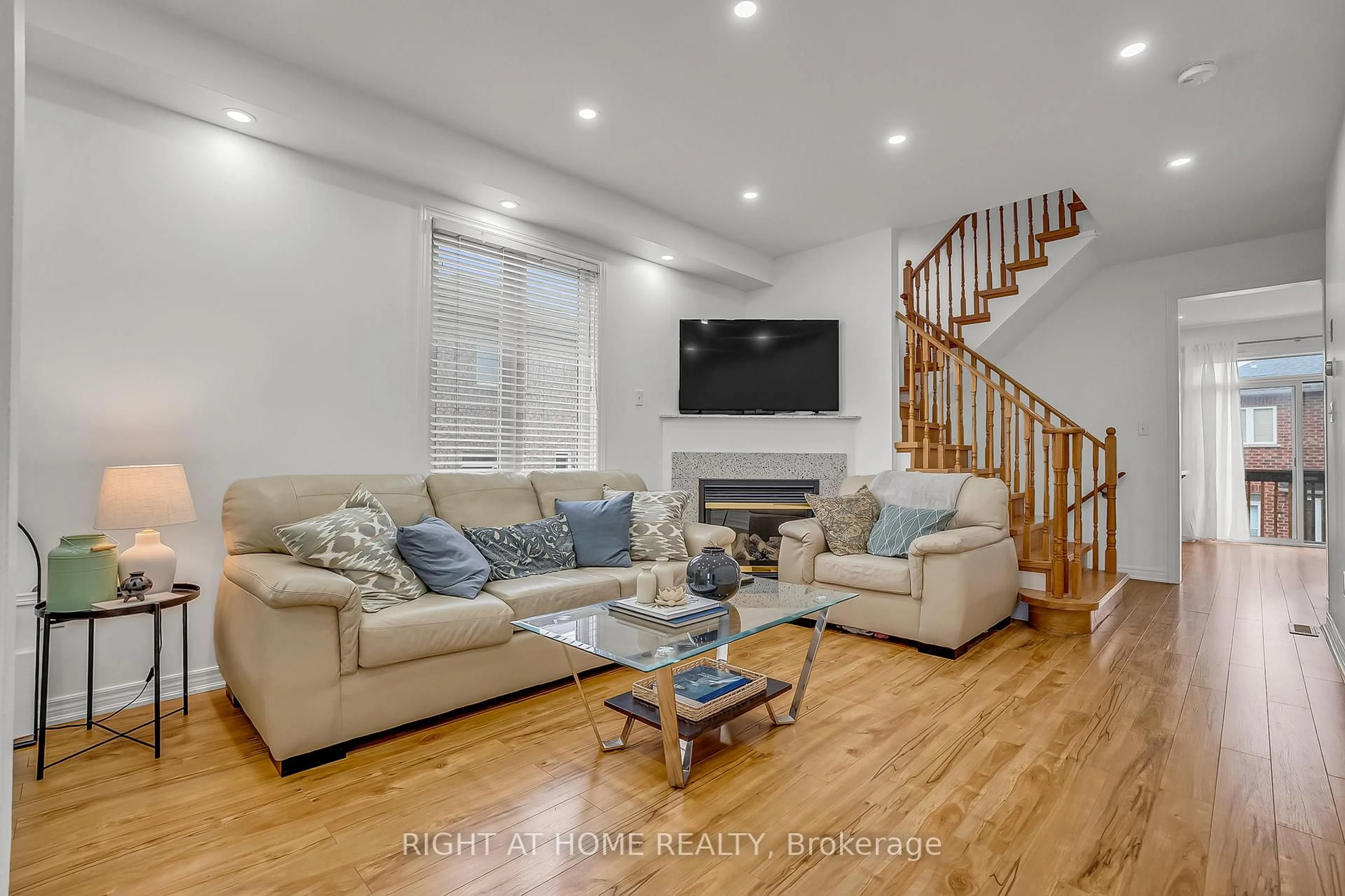 Living room with furniture, wood/laminate floor for 11 Tobermory Cres, Brampton Ontario L6V 4T6