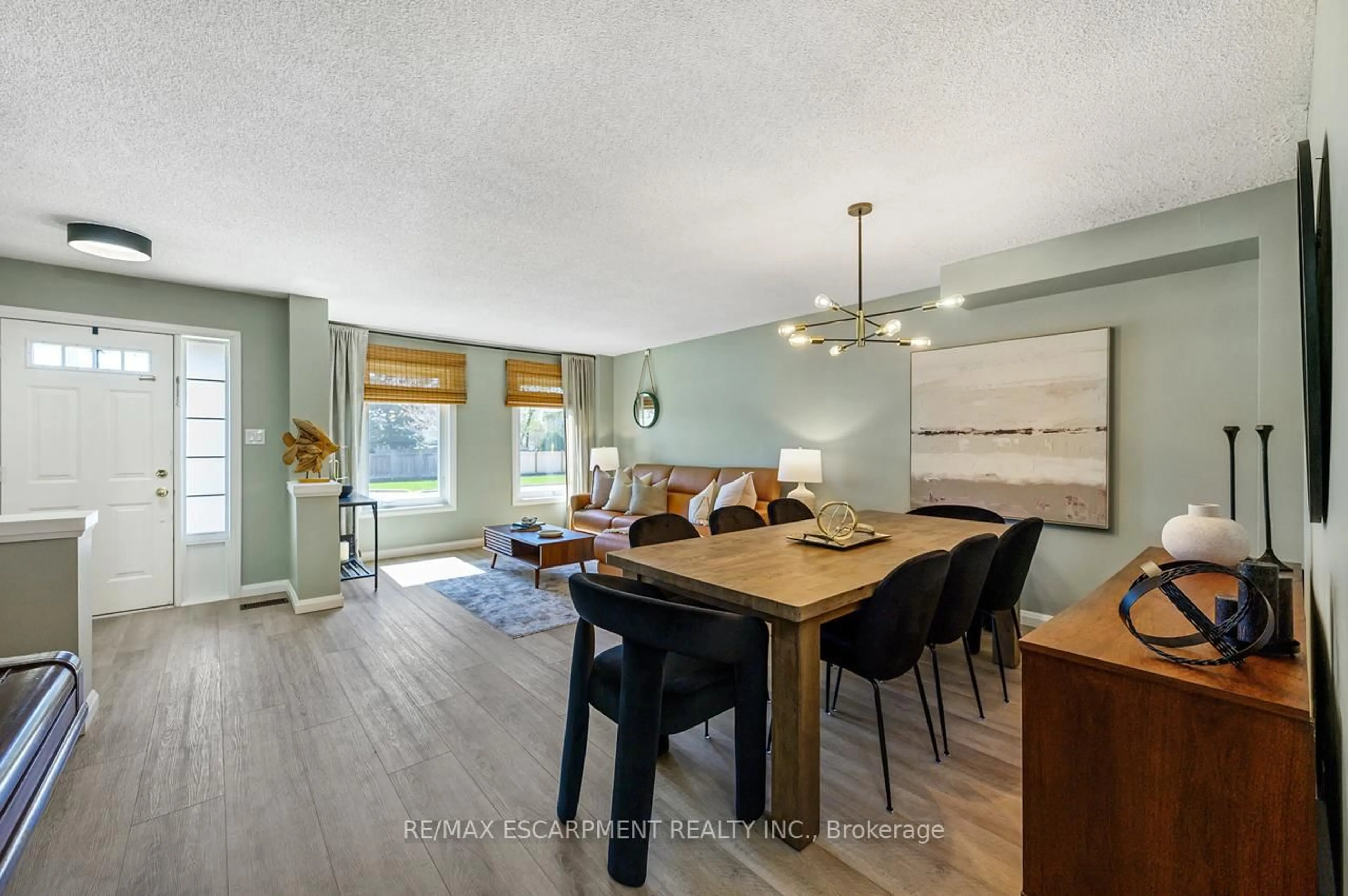 Open concept kitchen, wood/laminate floor for 100 Manley Lane, Milton Ontario L9T 5N9