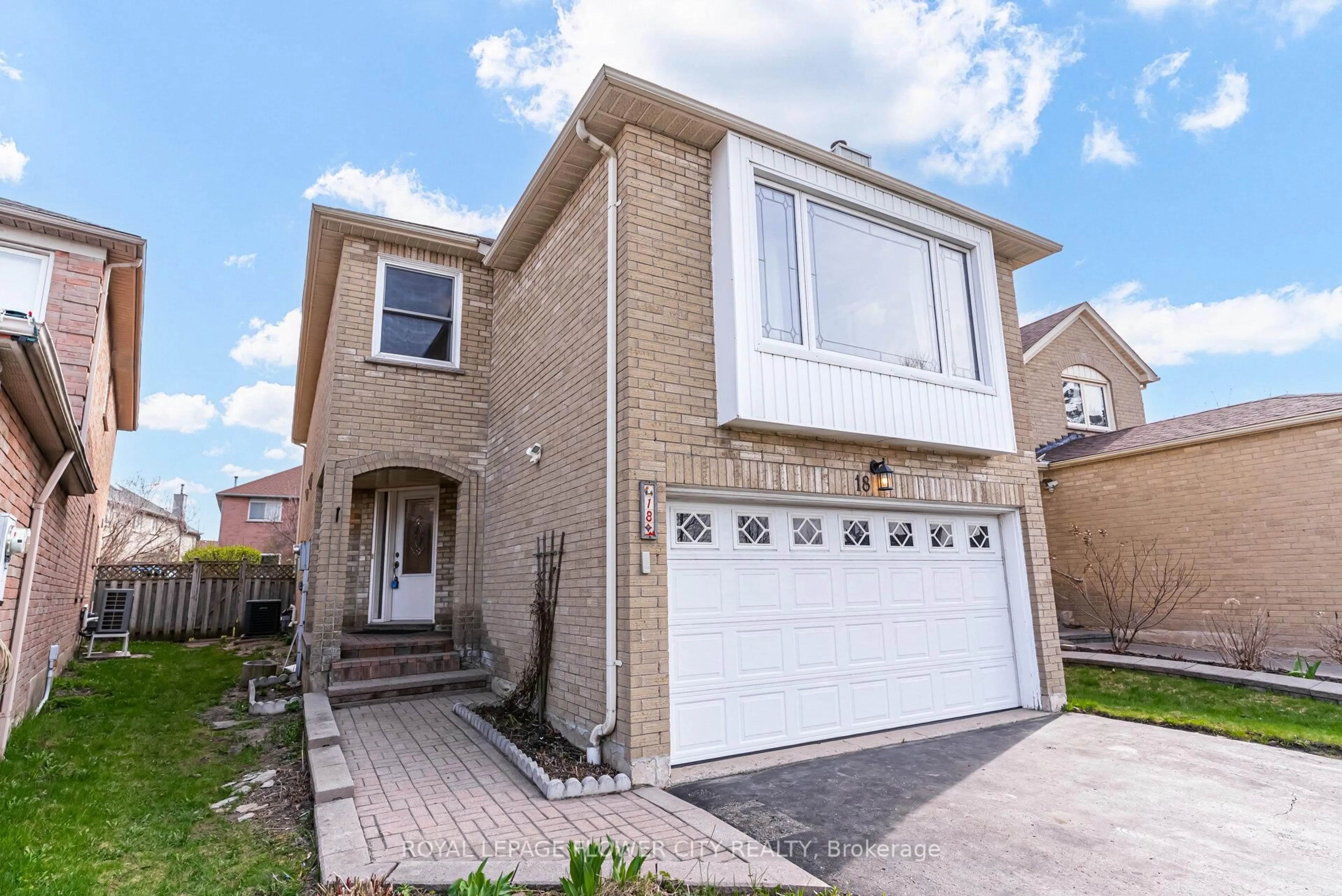 Home with brick exterior material, street for 18 Nature Crt, Brampton Ontario L6S 5T8