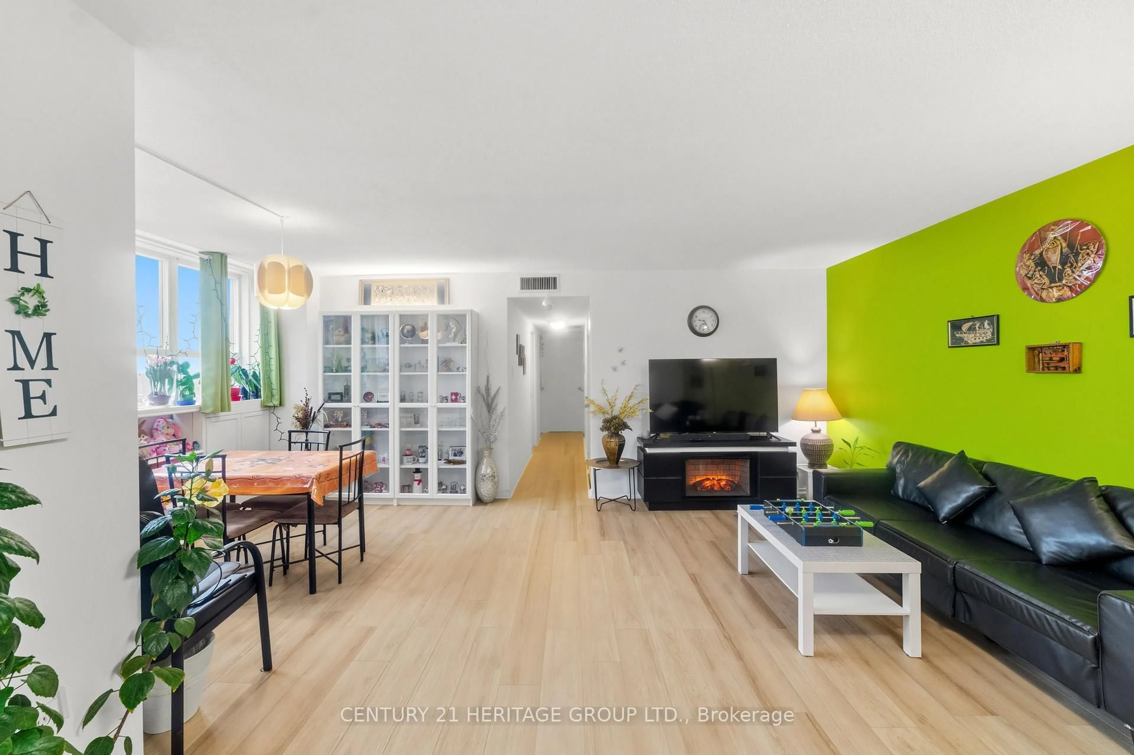 Living room with furniture, wood/laminate floor for 2323 Confederation Pkwy #1408, Mississauga Ontario L5B 1R6