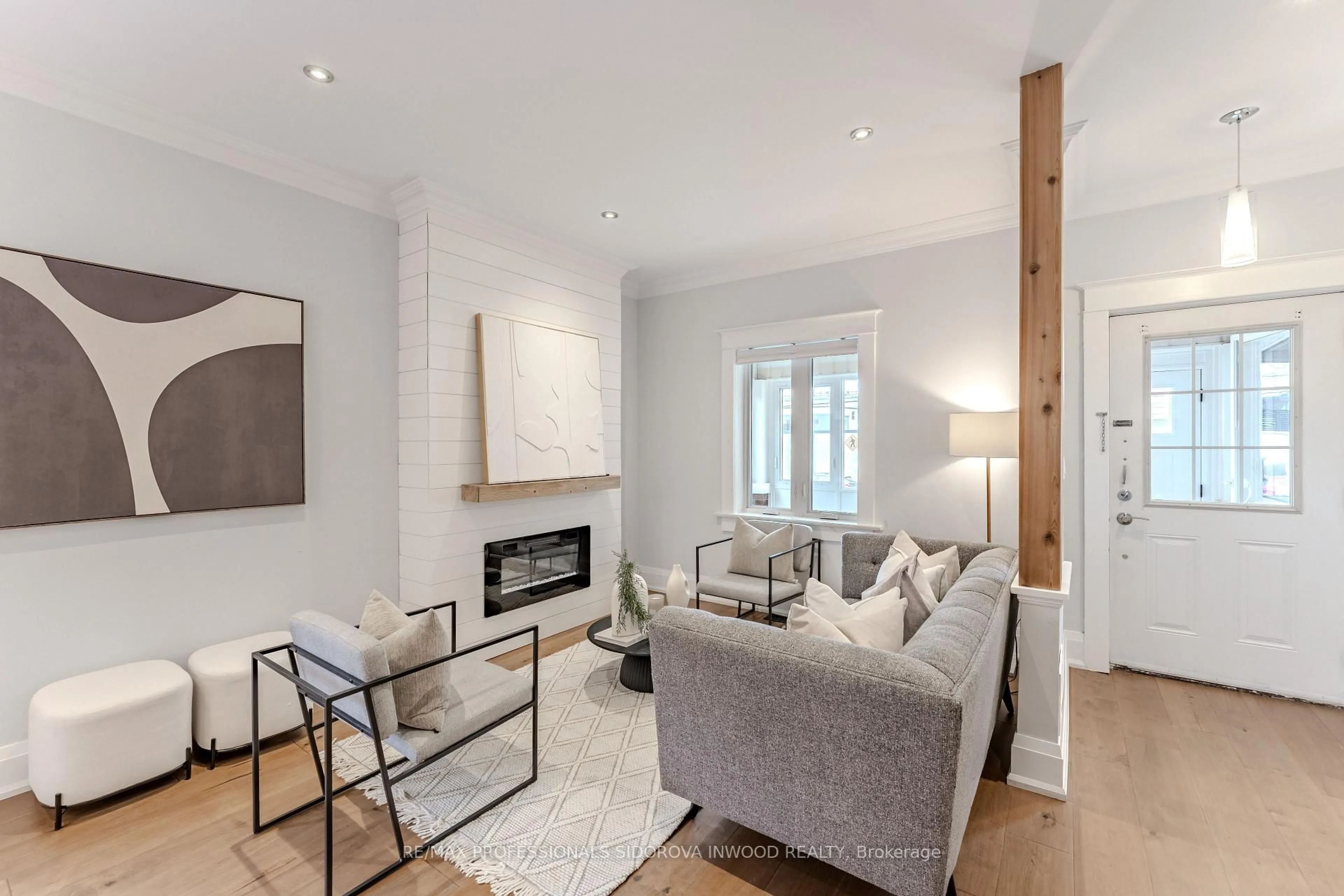 Living room with furniture, wood/laminate floor for 640 Runnymede Rd, Toronto Ontario M6S 3A2