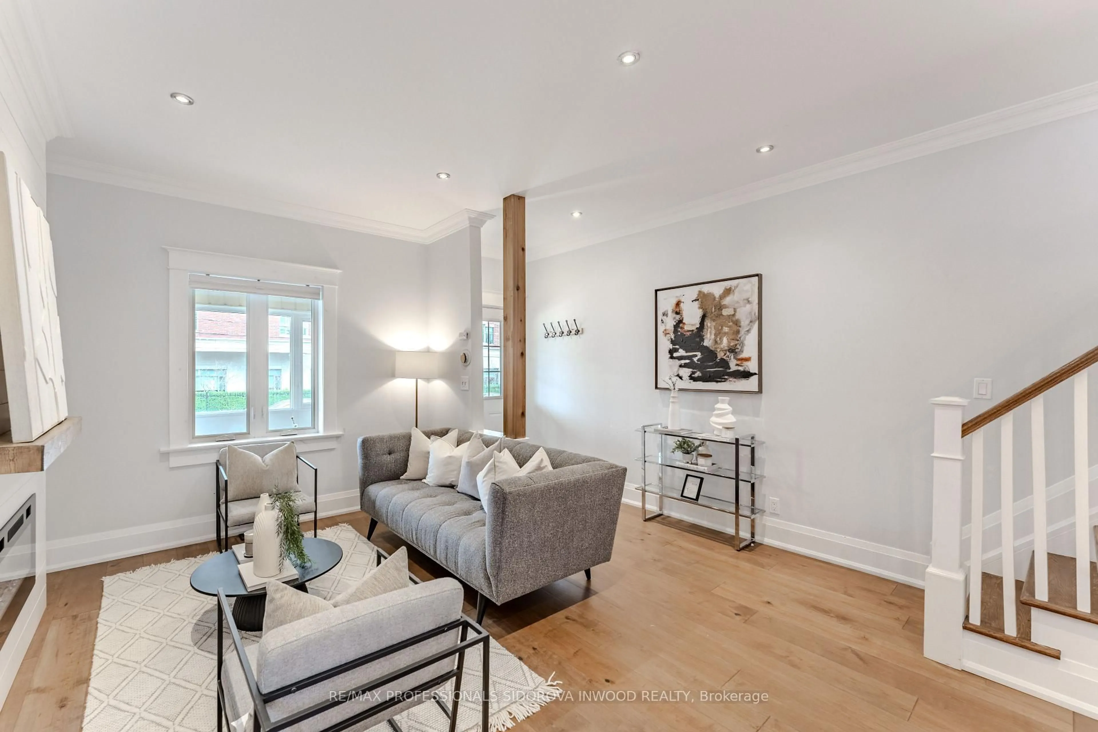 Living room with furniture, wood/laminate floor for 640 Runnymede Rd, Toronto Ontario M6S 3A2